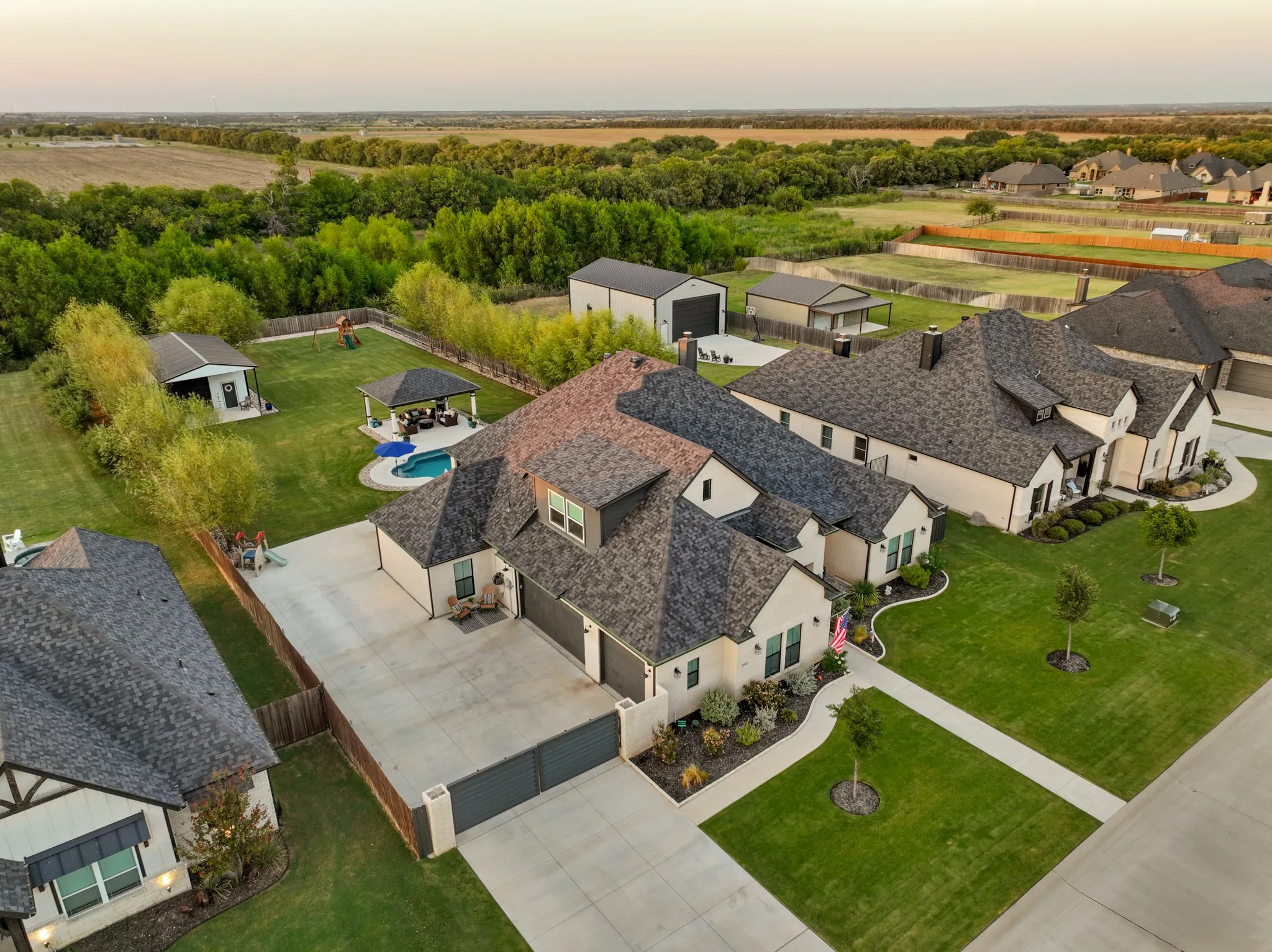 Privately positioned behind an electric gate & surrounded by the serenity of a pond & greenbelt with no rear neighbor, this extraordinary residence delivers a rare combination of privacy, scale, luxury customization & lifestyle.