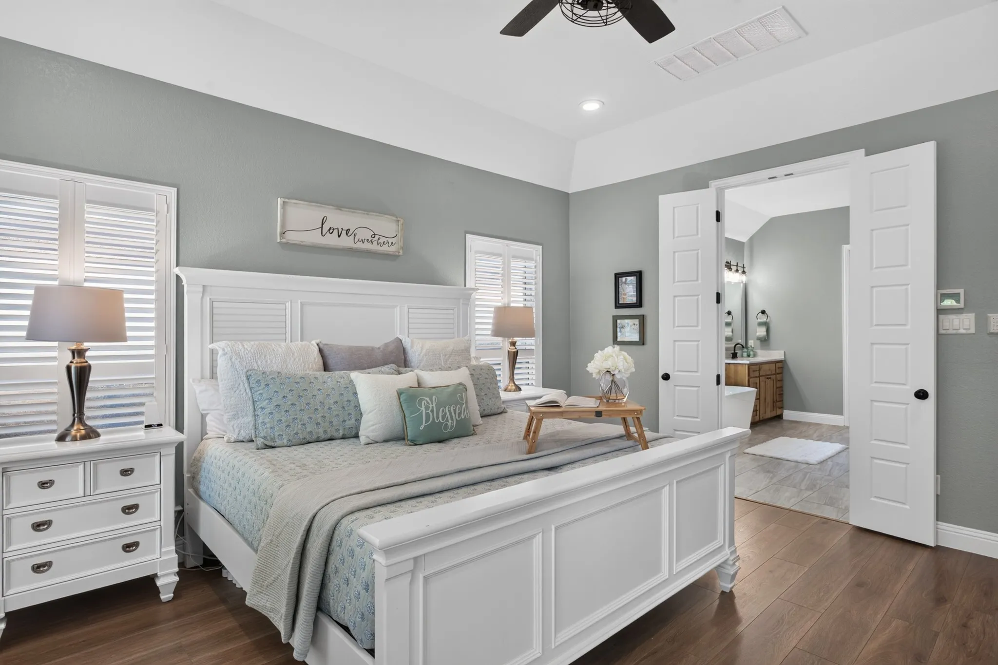 The primary suite offers shutters, a customized closet & elevated bath finishes with thoughtful details throughout that make everyday living feel effortless.