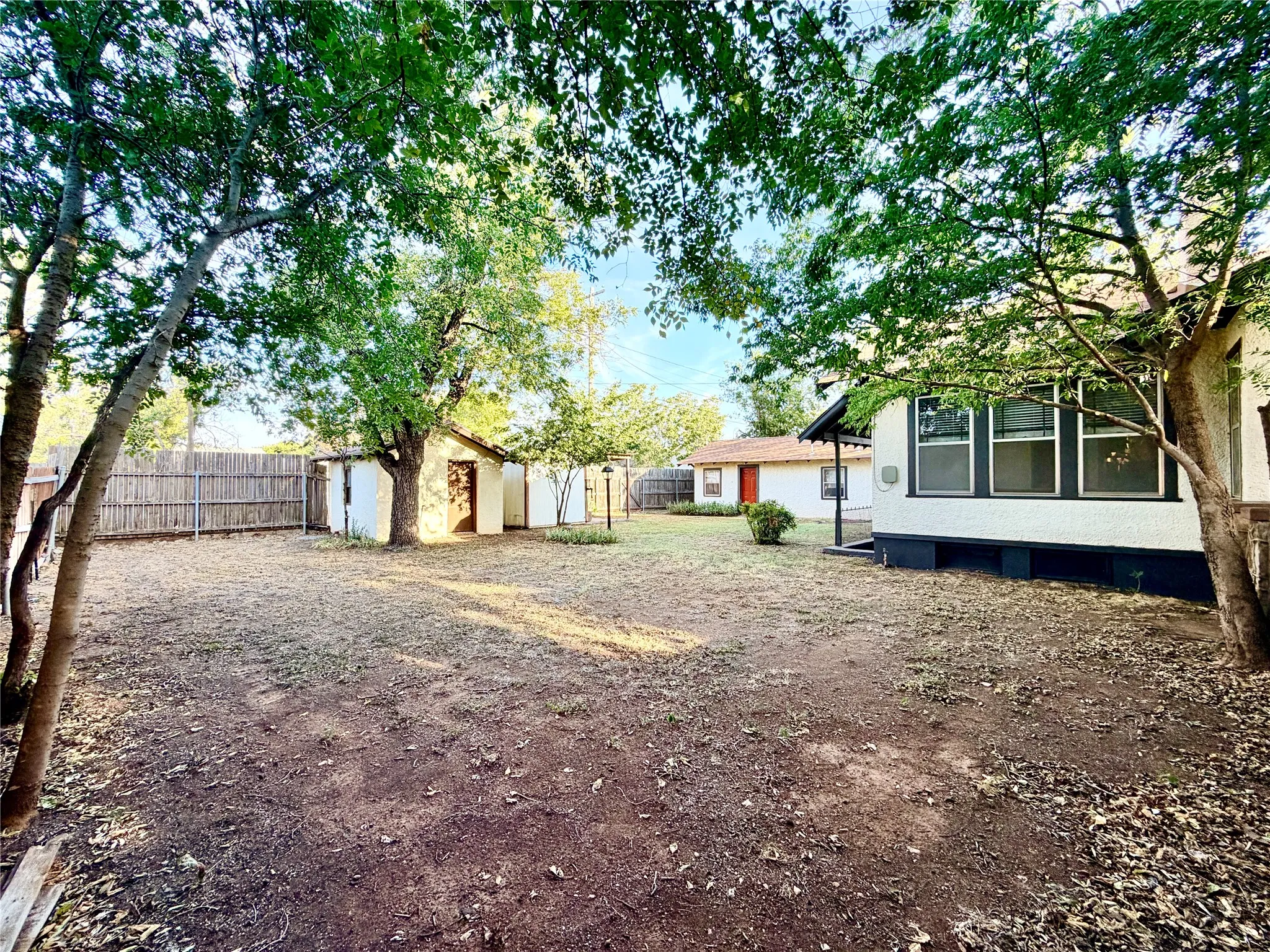 Back Yard with well house, storage shed and guest quarters