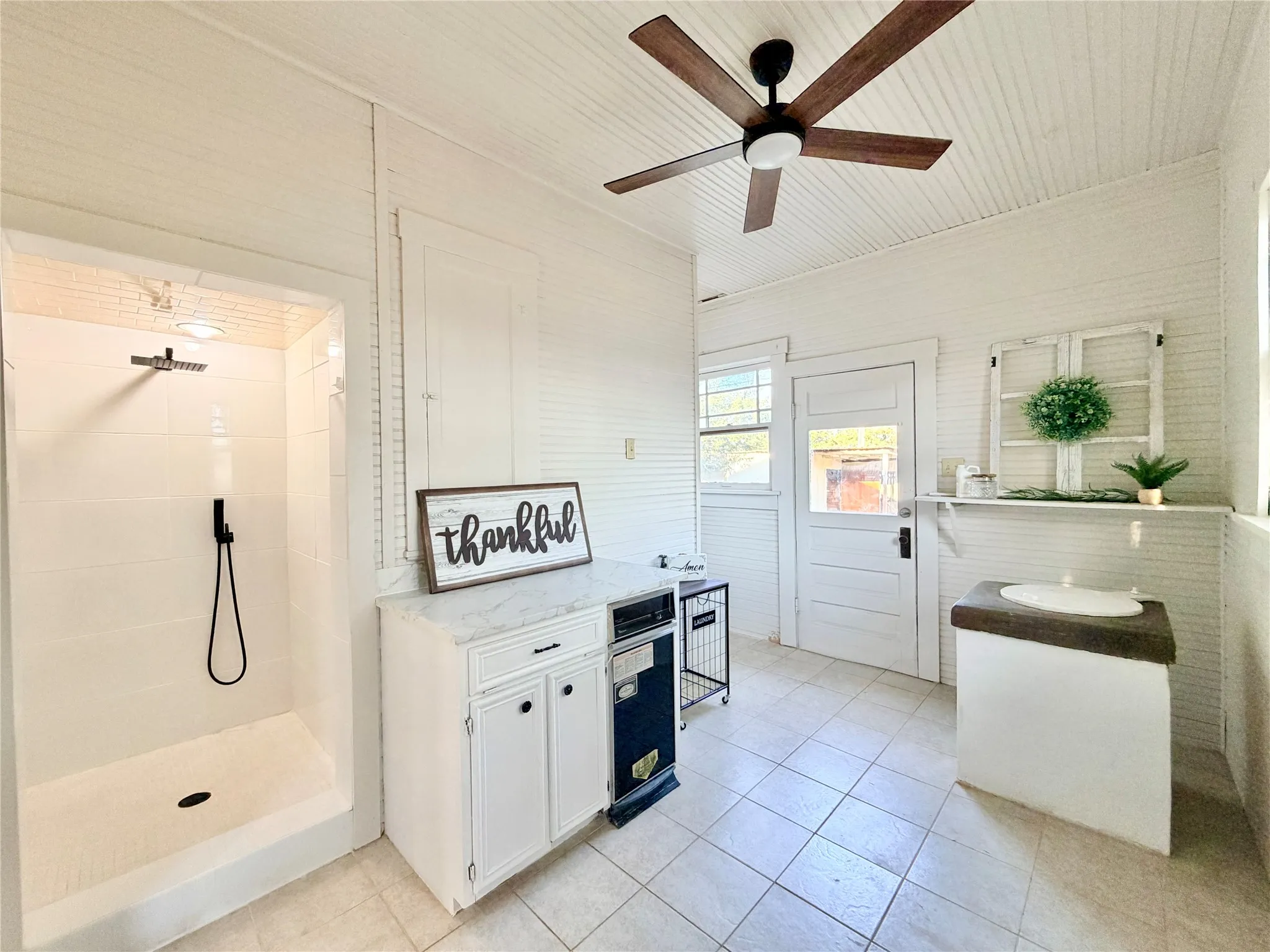 Mud room with dog shower