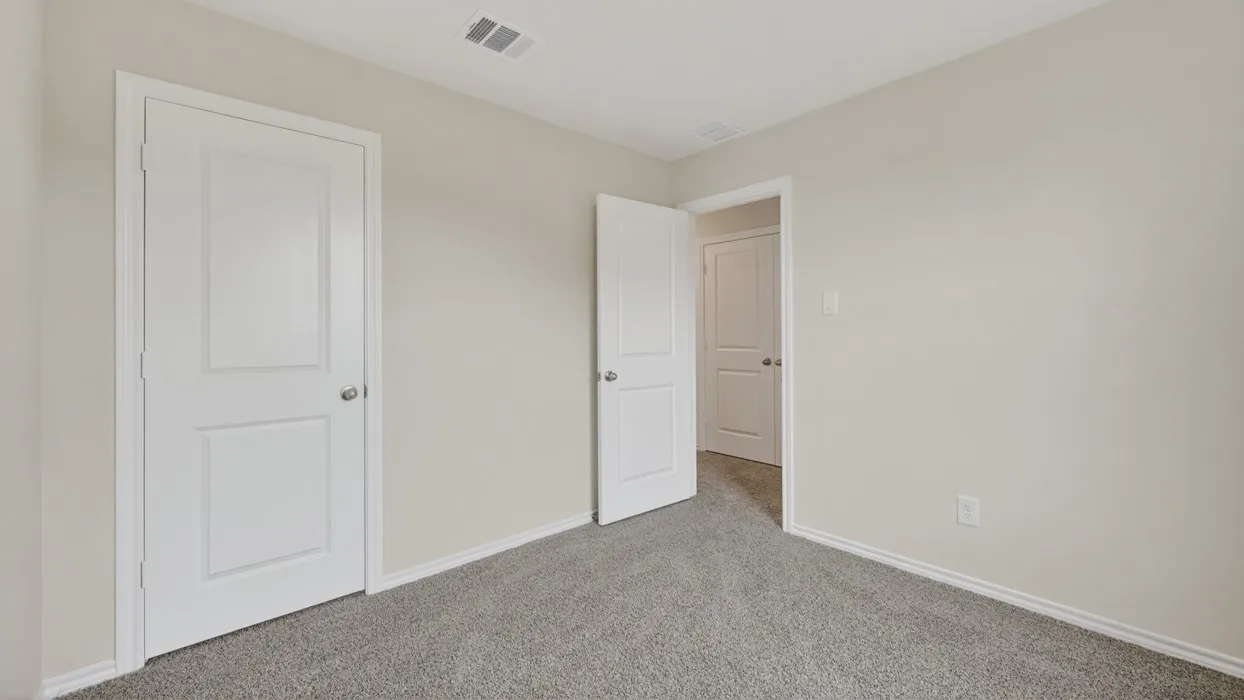 Grey carpeting with light-toned walls