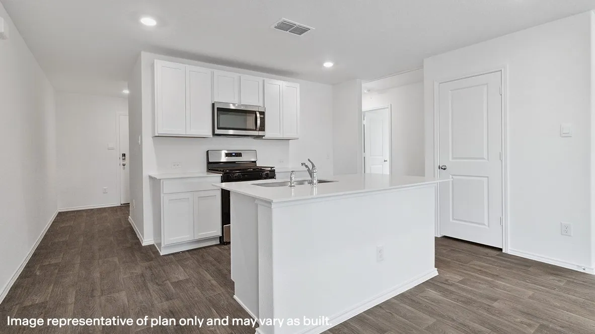 Kitchen featuring an island with a sink, white cabinetry, stainless steel appliances, and wood-finish flooring