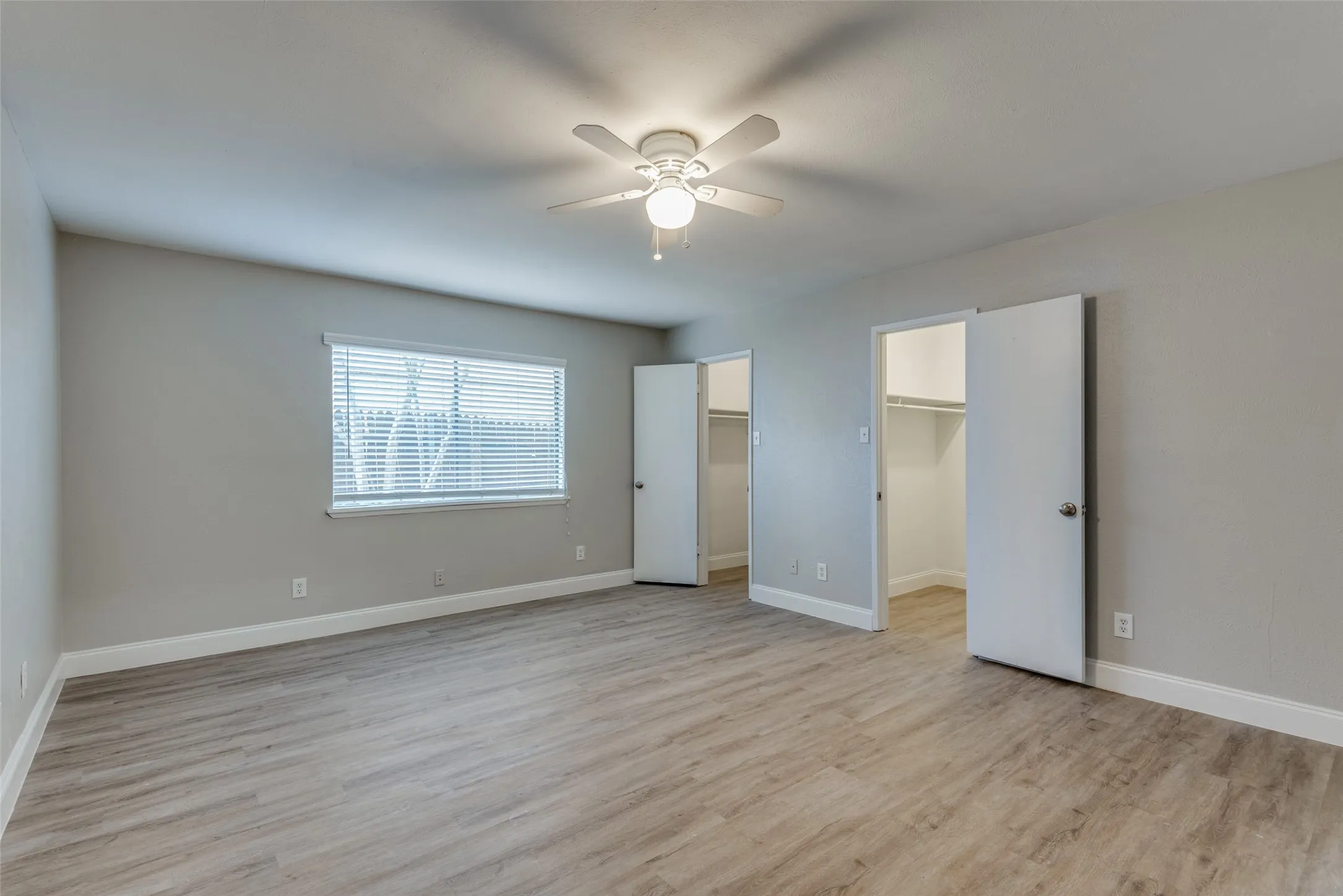 Primary Bedroom, View of Two Attached Walk In Closets