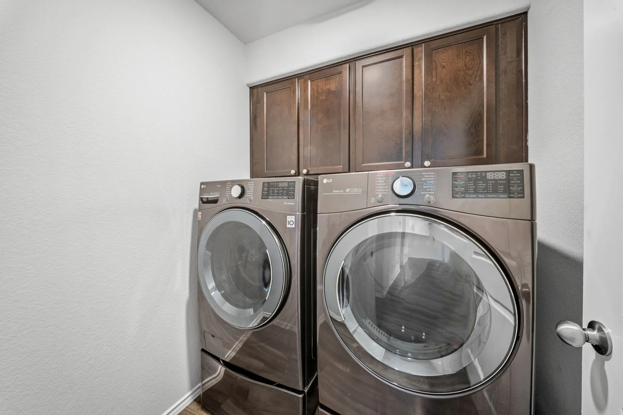 Built-in cabinetry with dark wood-finish doors