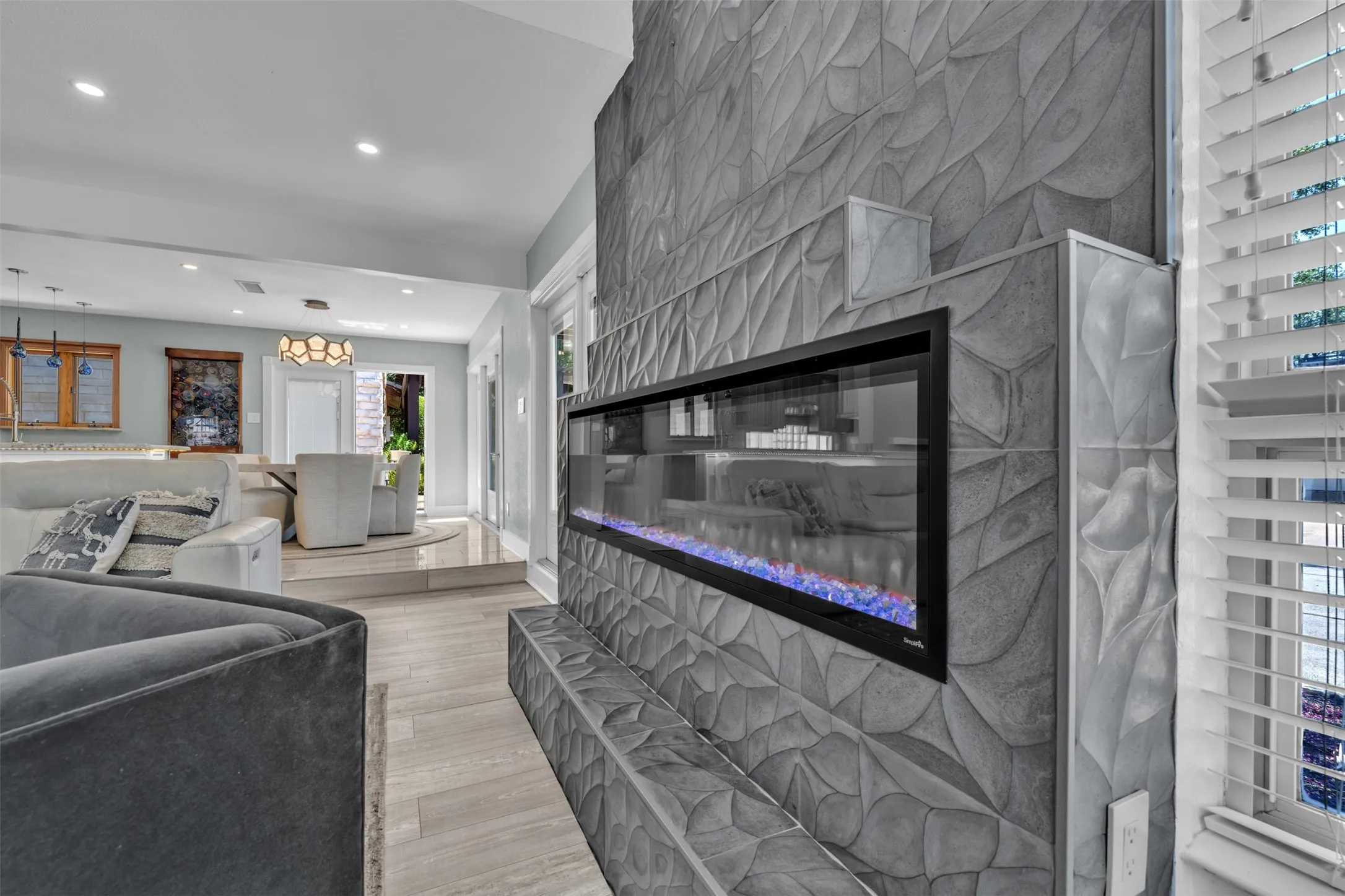 Open concept to dining and kitchen  with views to park and lake open to outside dining and living