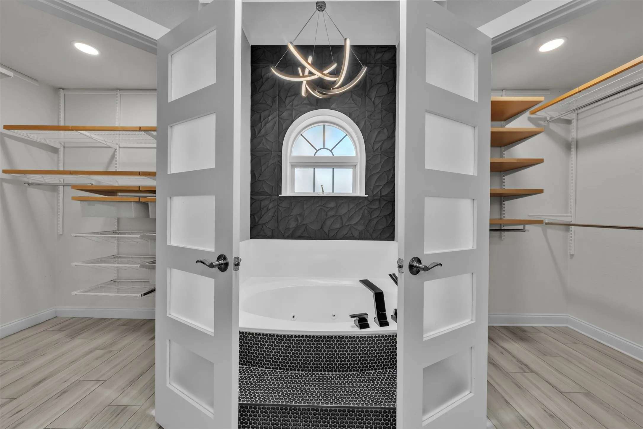 Double closet systems on either side of soaker tub