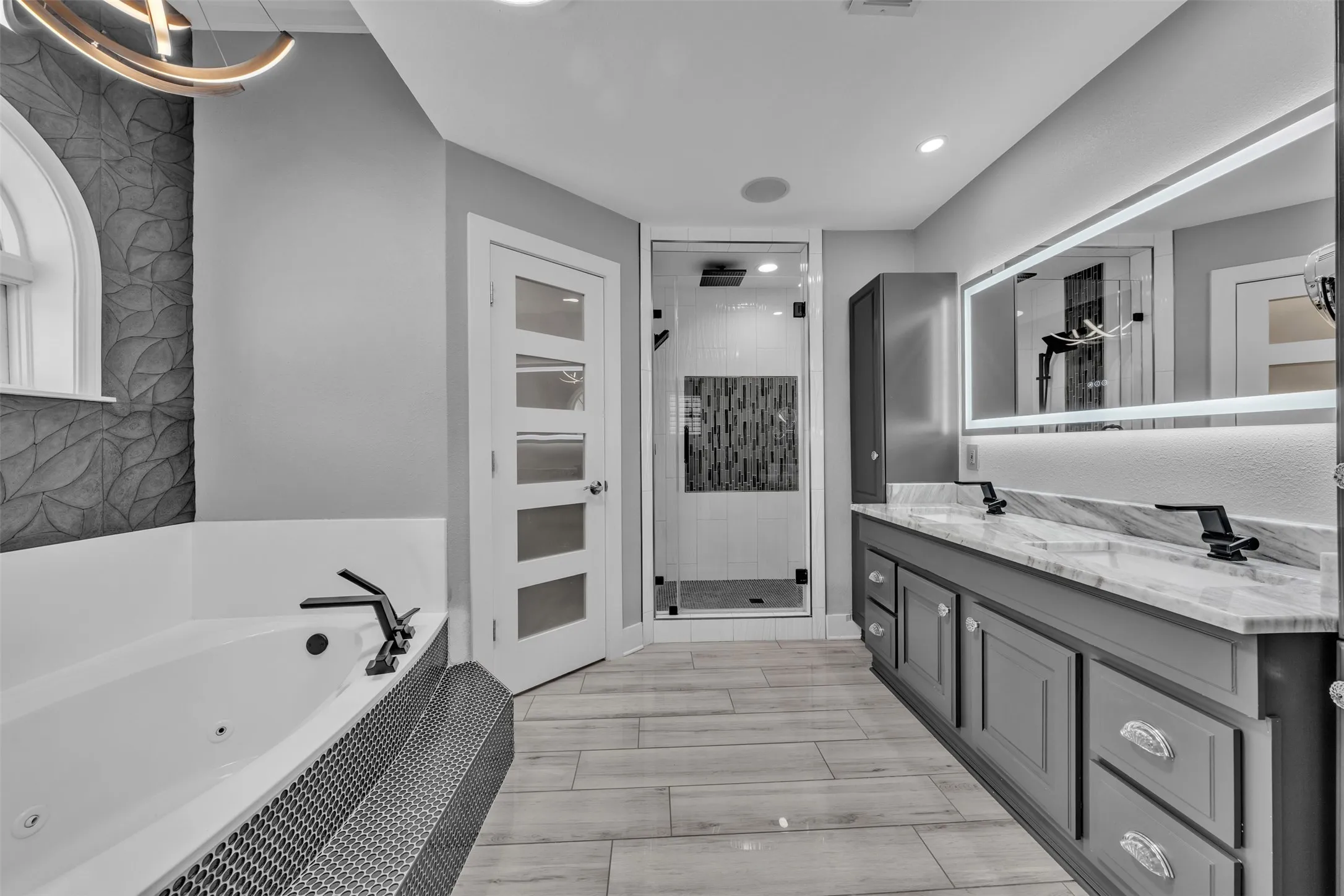 Soaker tub and double closets with custom systems
