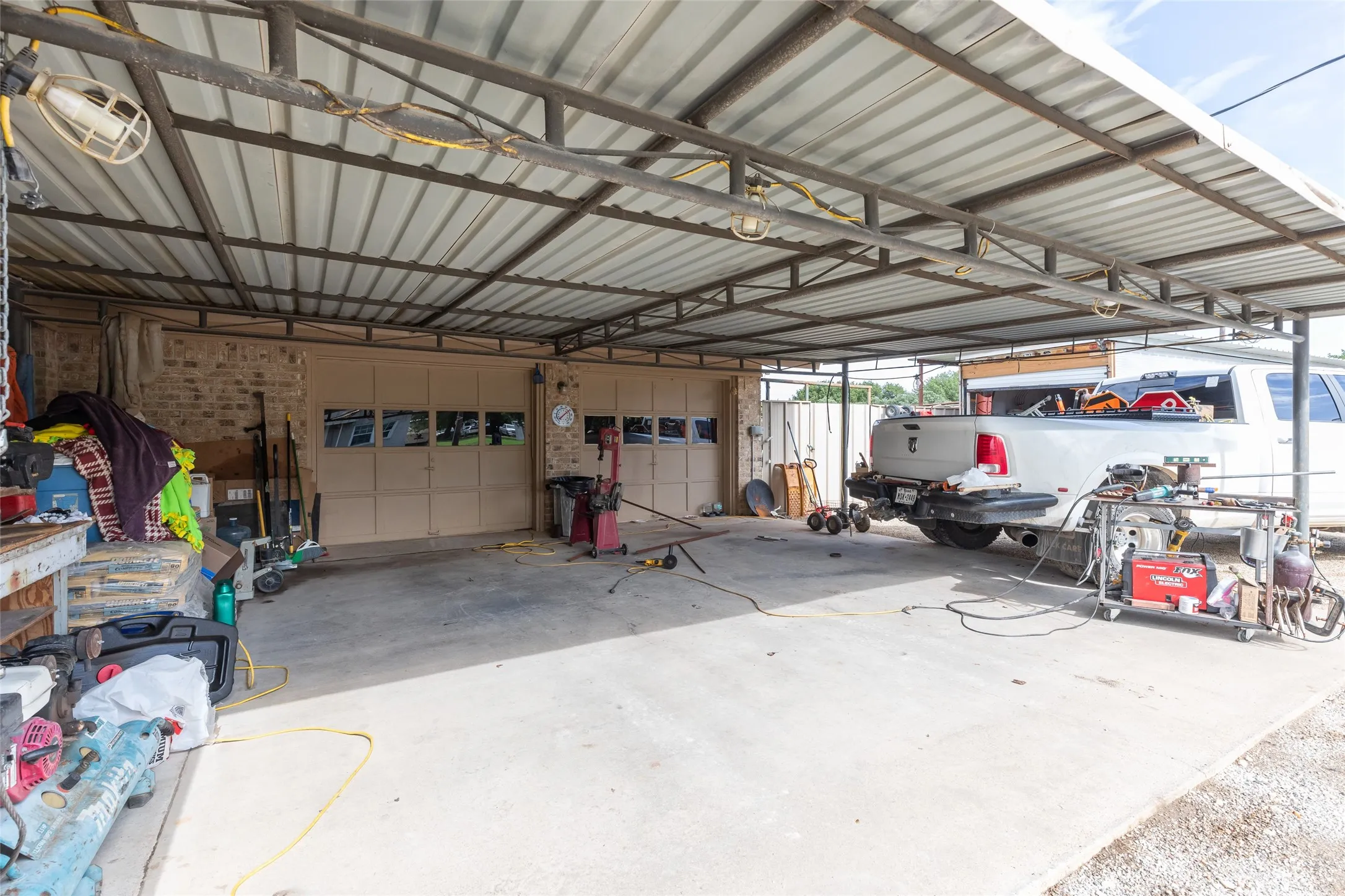 Two car garage with 2 car port spaces.