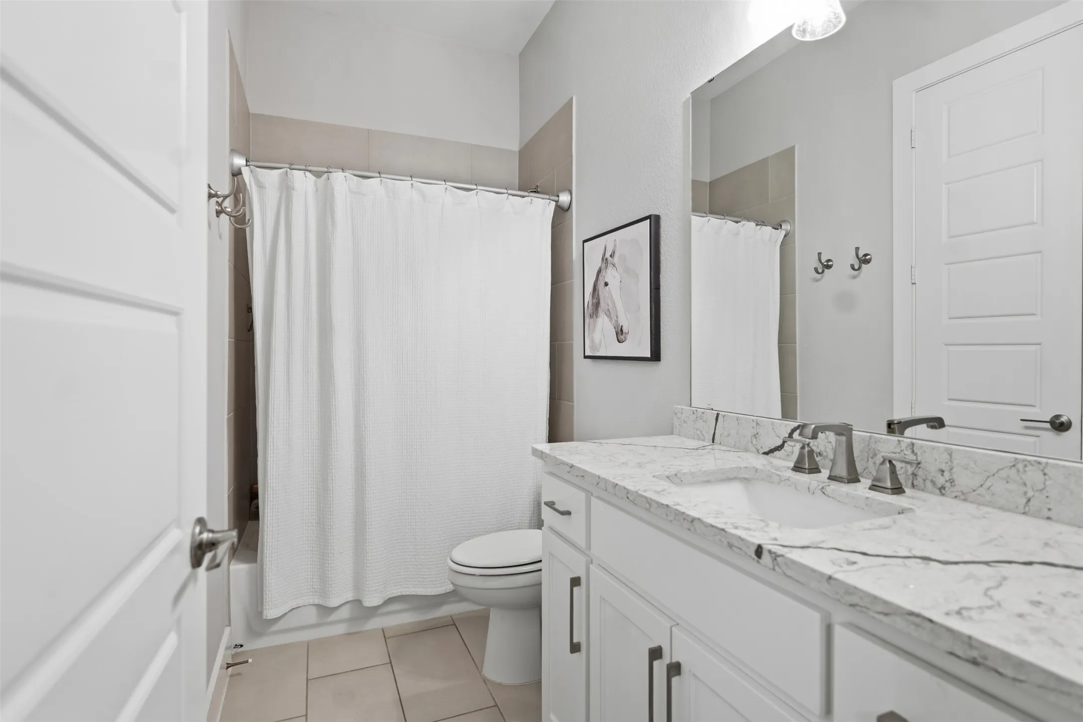 Bathroom 3 Ensuite - White vanity with a single basin, stone countertop, and brushed nickel fixtures