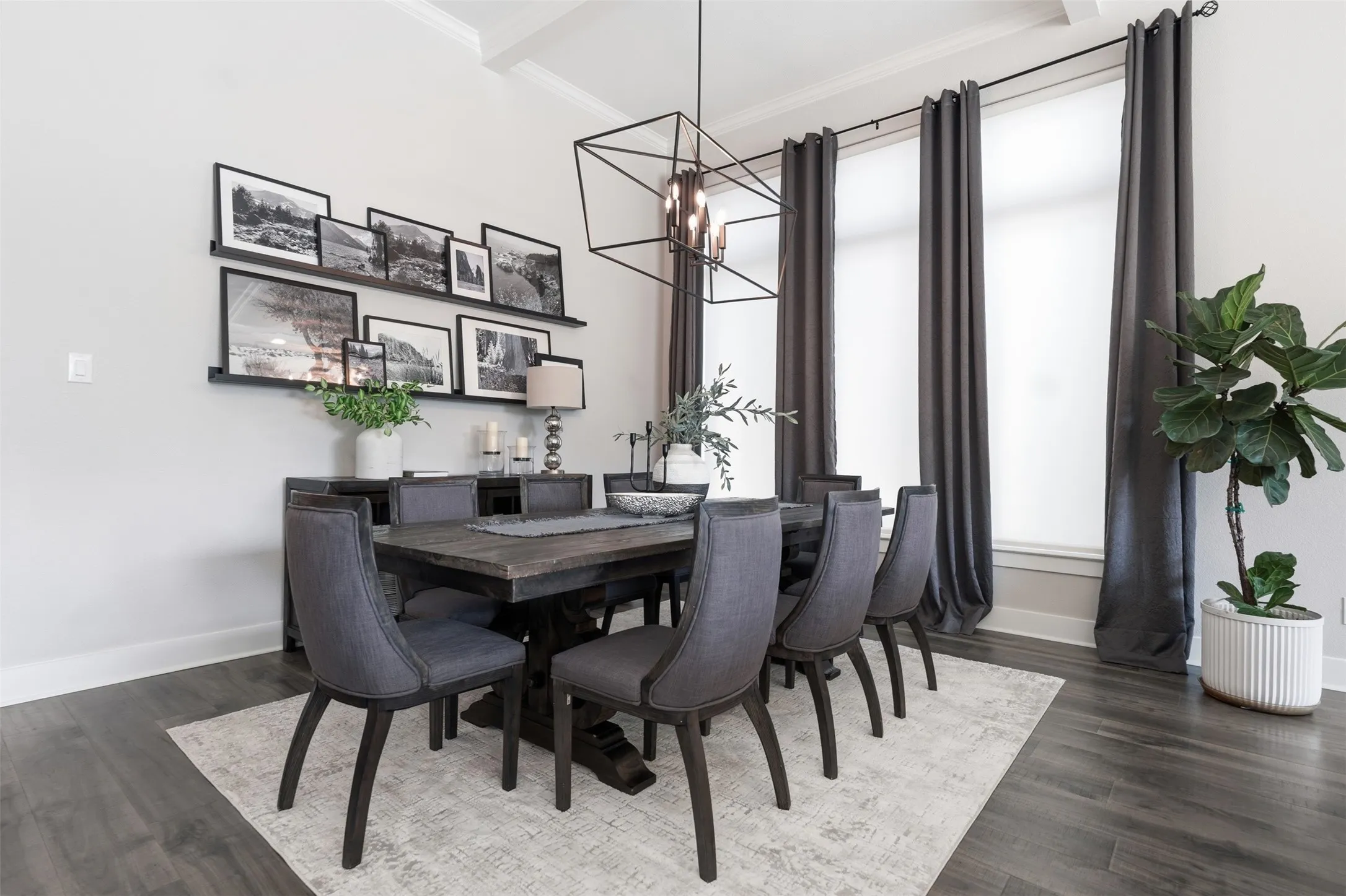 Wood-finish flooring with a neutral wall color, crown molding, and recessed lighting