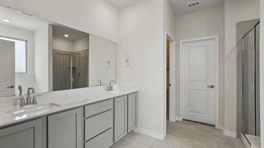Dual sink vanity with light gray cabinetry