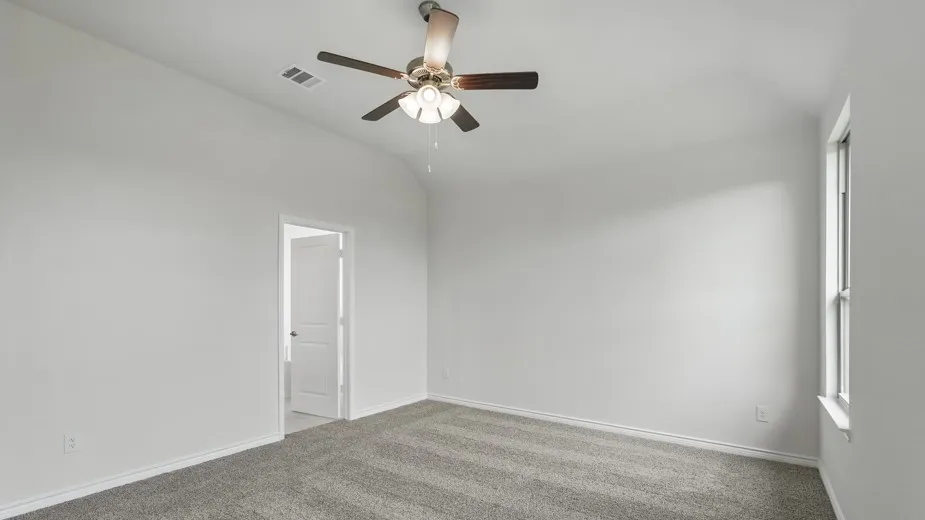 Recessed ceiling, ceiling fan with light fixture, gray carpet flooring, white walls, and a white window frame