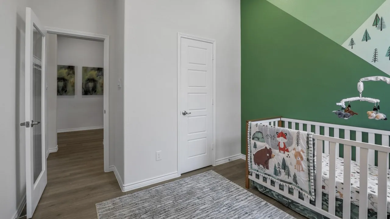 Wood-finish flooring, white paneled door, and French paneled door