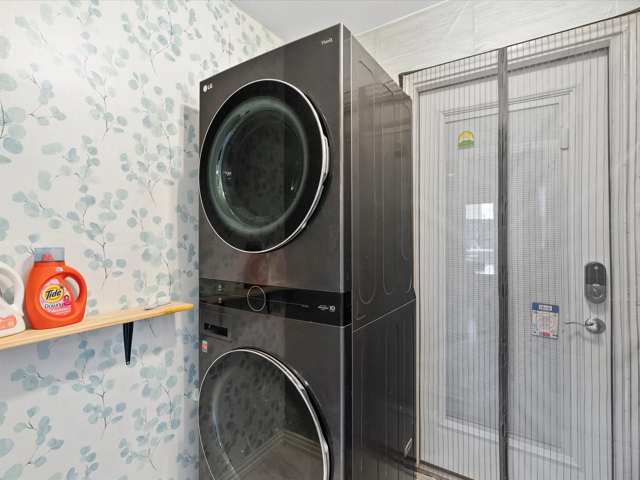 Stacked laundry appliances with a front-loading design