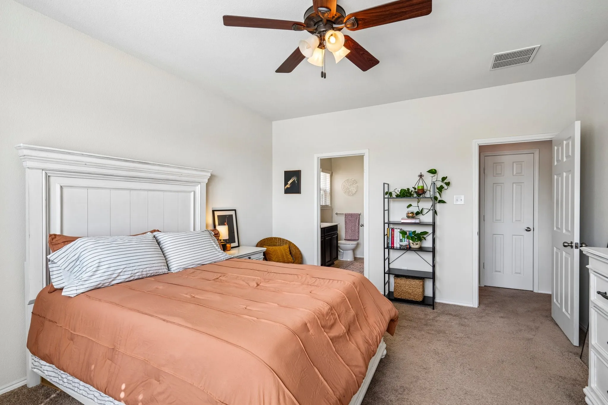 Recessed lighting, ceiling fan, and light-colored carpeting throughout