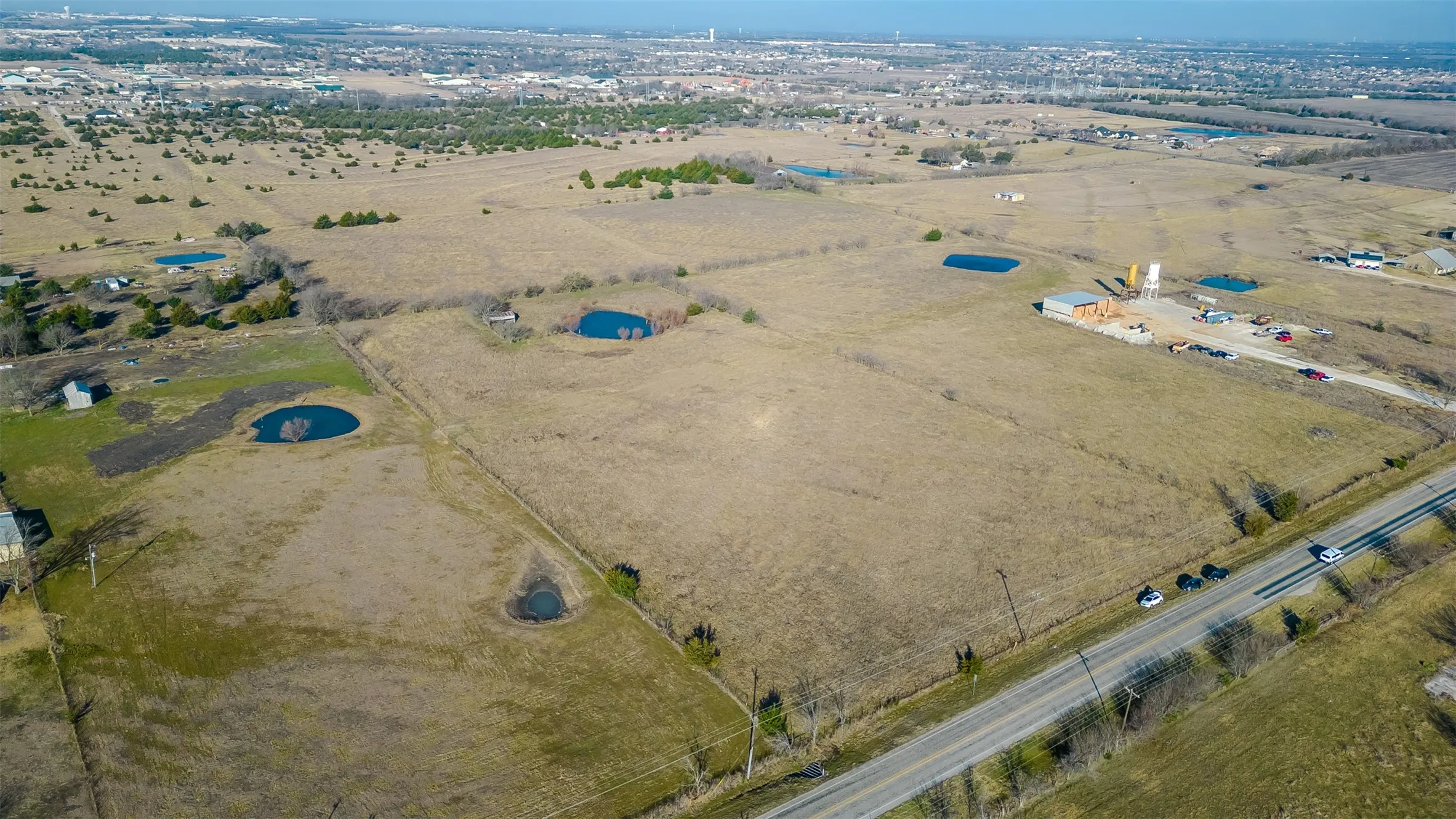 Expansive land parcel featuring direct road frontage
