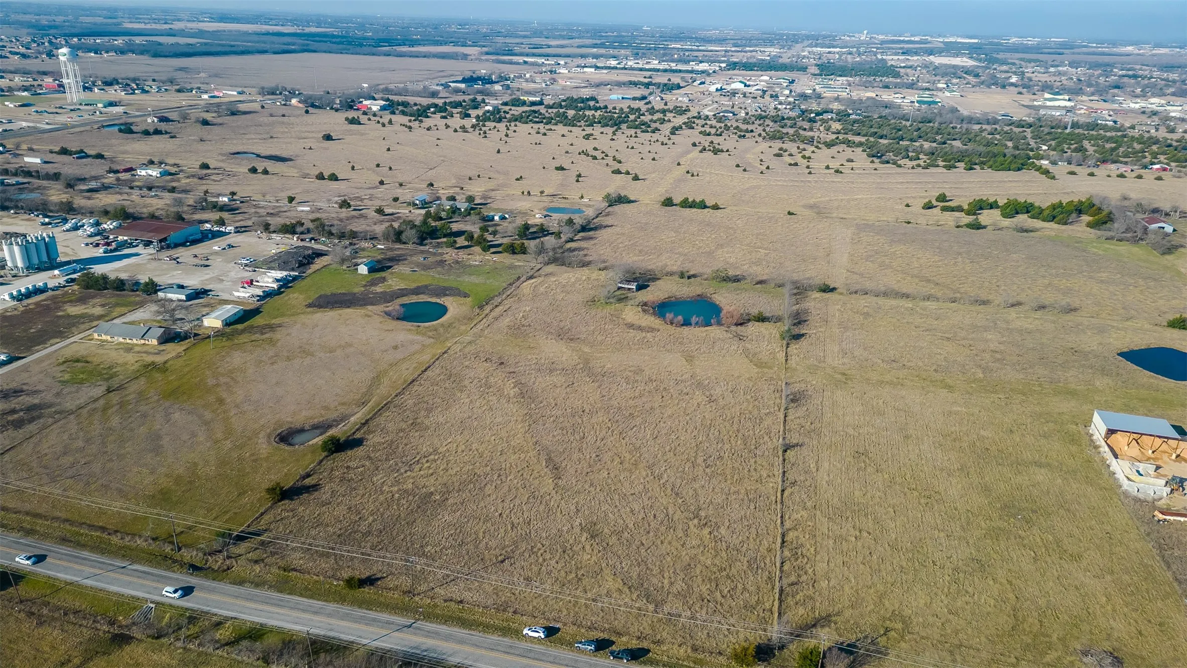 Expansive land parcel featuring a highway frontage, and varied topography
