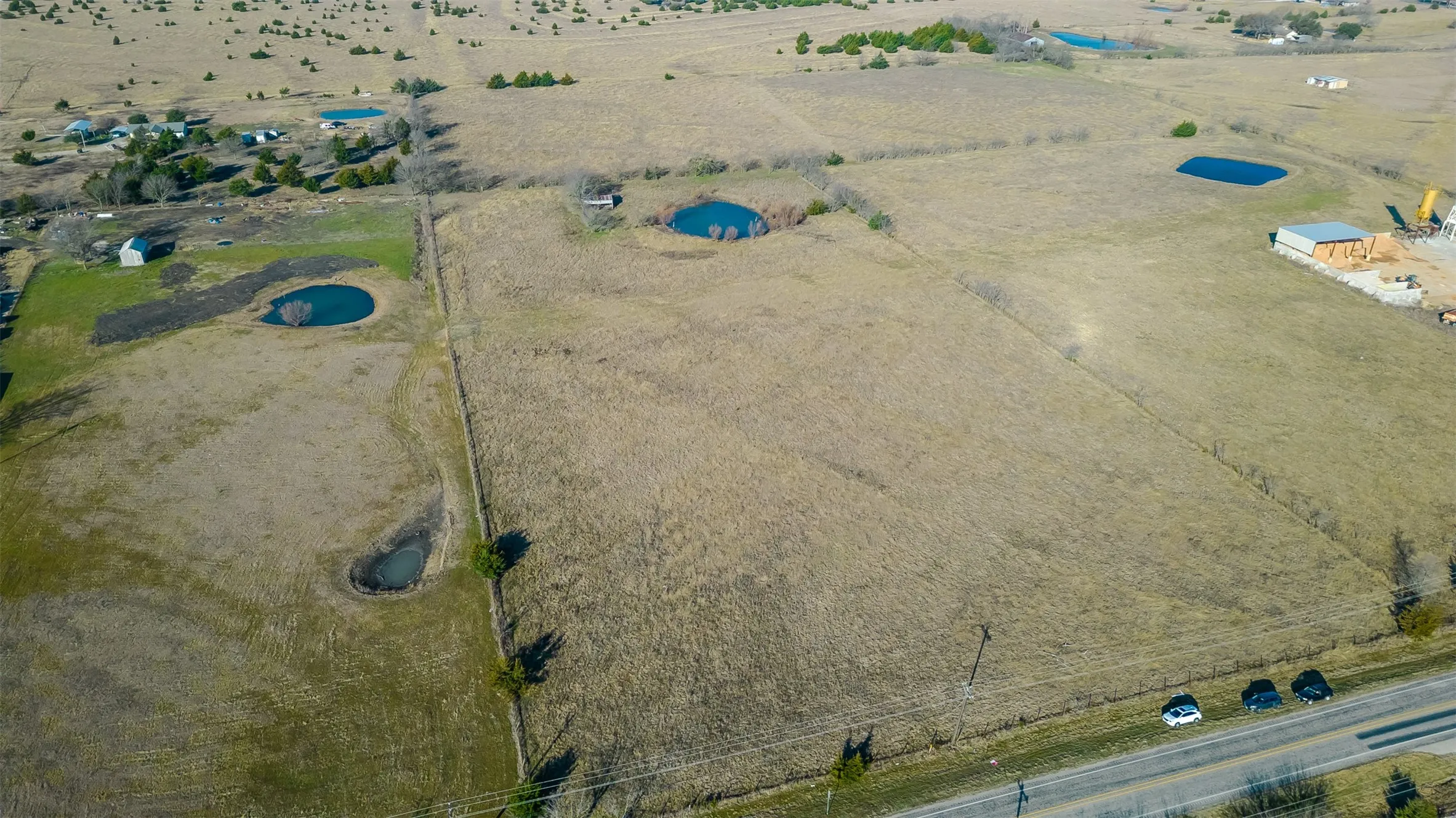 Expansive open land with perimeter fencing
