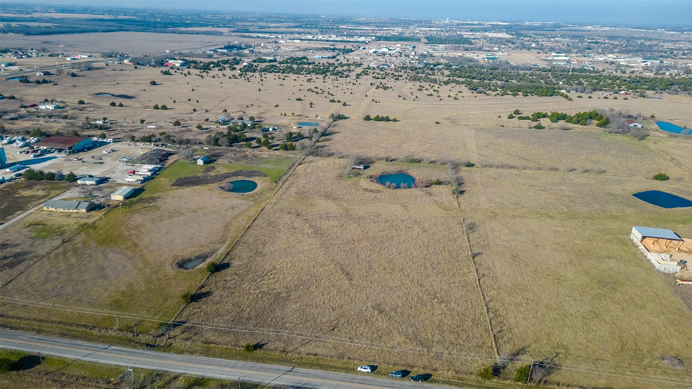 Expansive land parcel featuring a clear road frontage