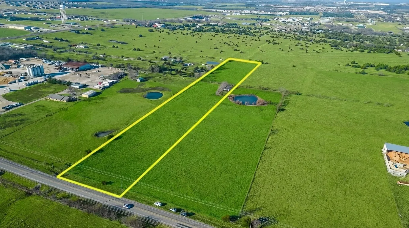 Expansive green acreage with roadside access