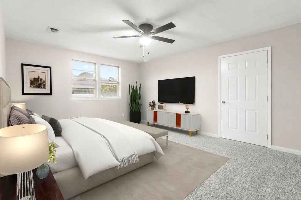 Neutral paint finishes, ceiling fan, carpet flooring, and multi-pane windows