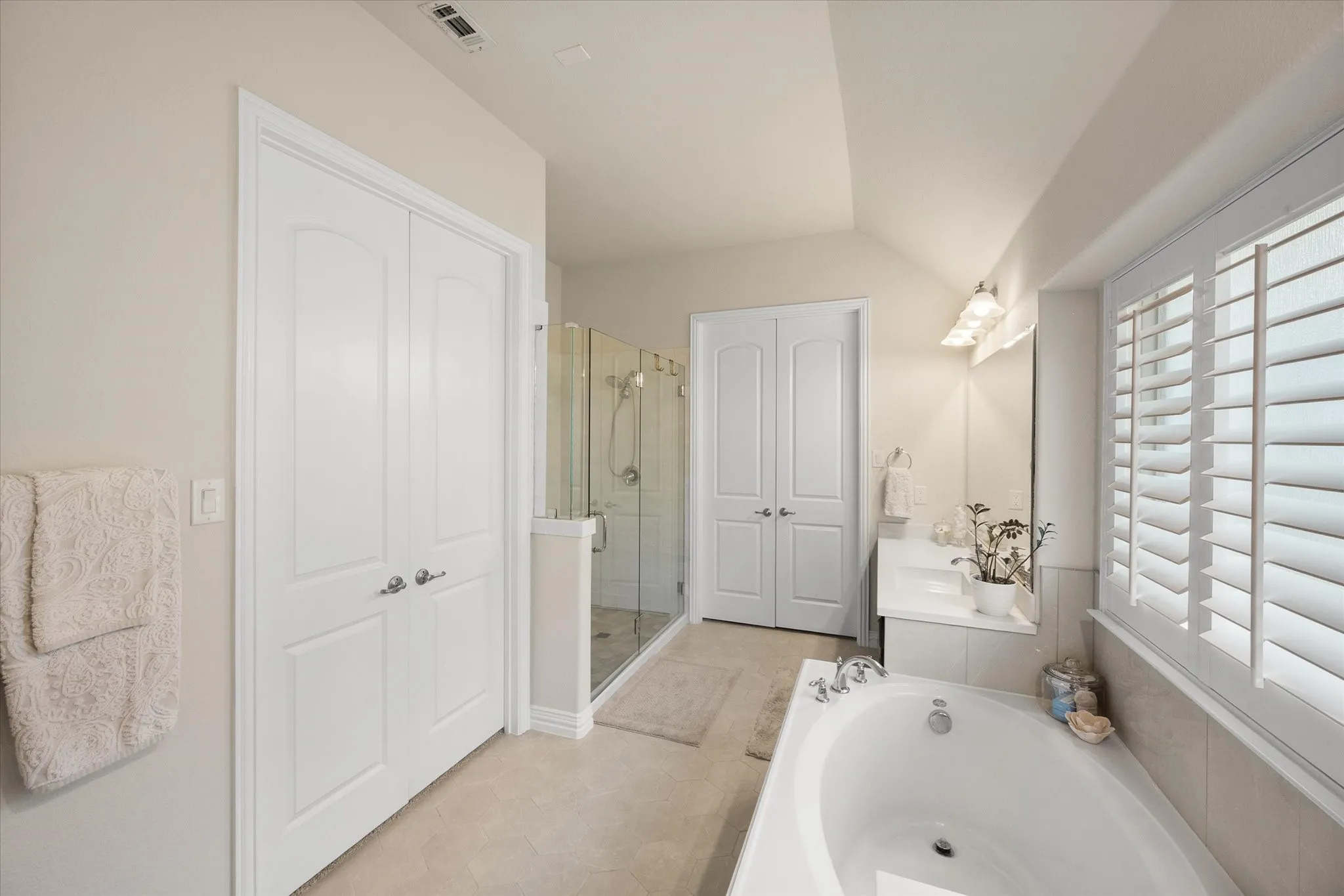 Primary bath with two walk-in closets