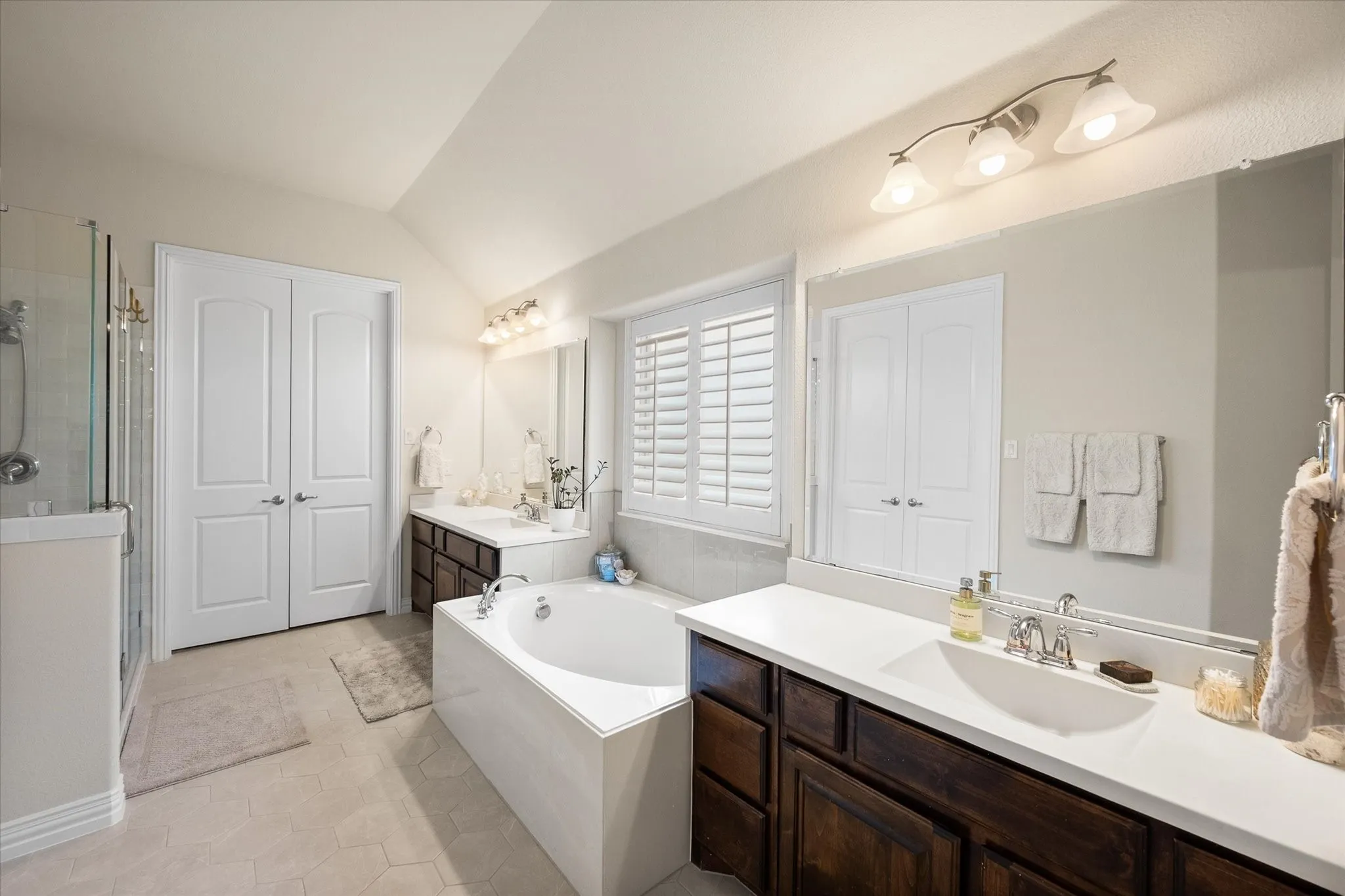 Primary bath with two walk-in closets