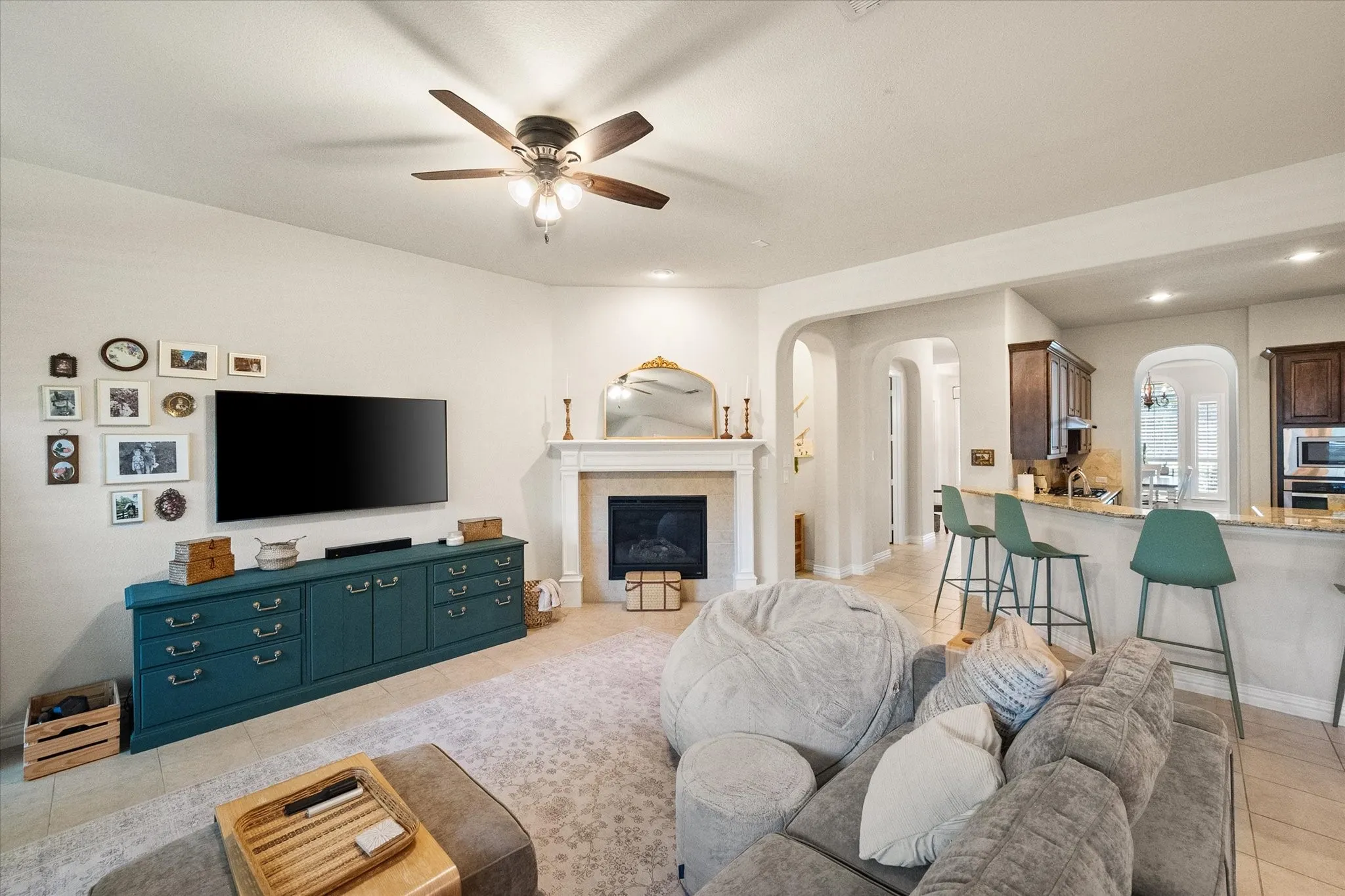 large open living area with view of bar and kitchen area