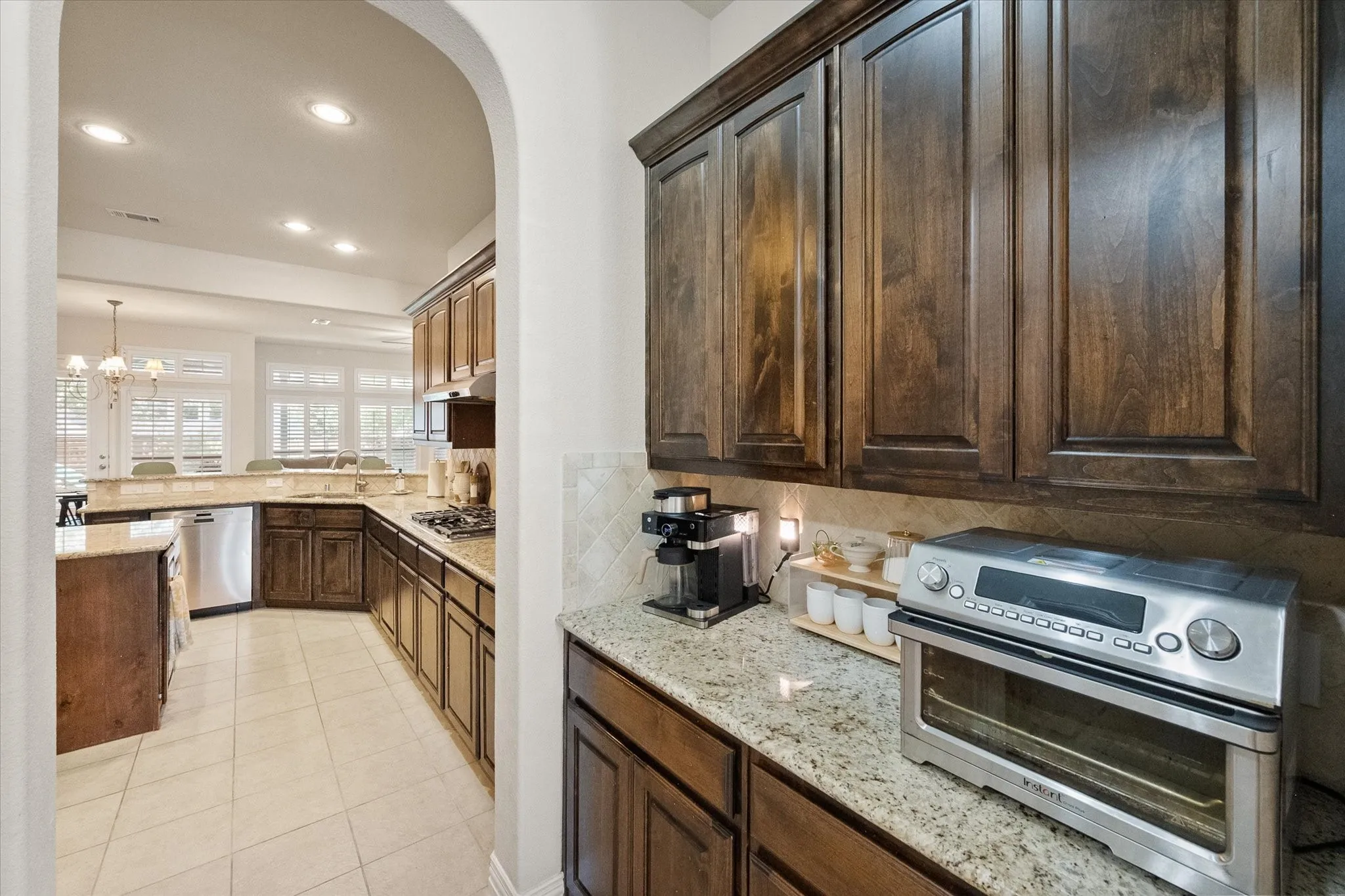 Butler's pantry and view of kitchen