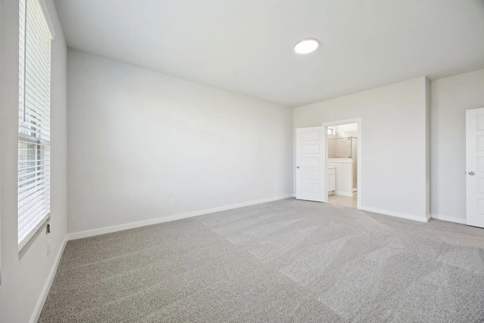 Primary Suite in the Masters home plan by Trophy Signature Homes – REPRESENTATIVE PHOTO