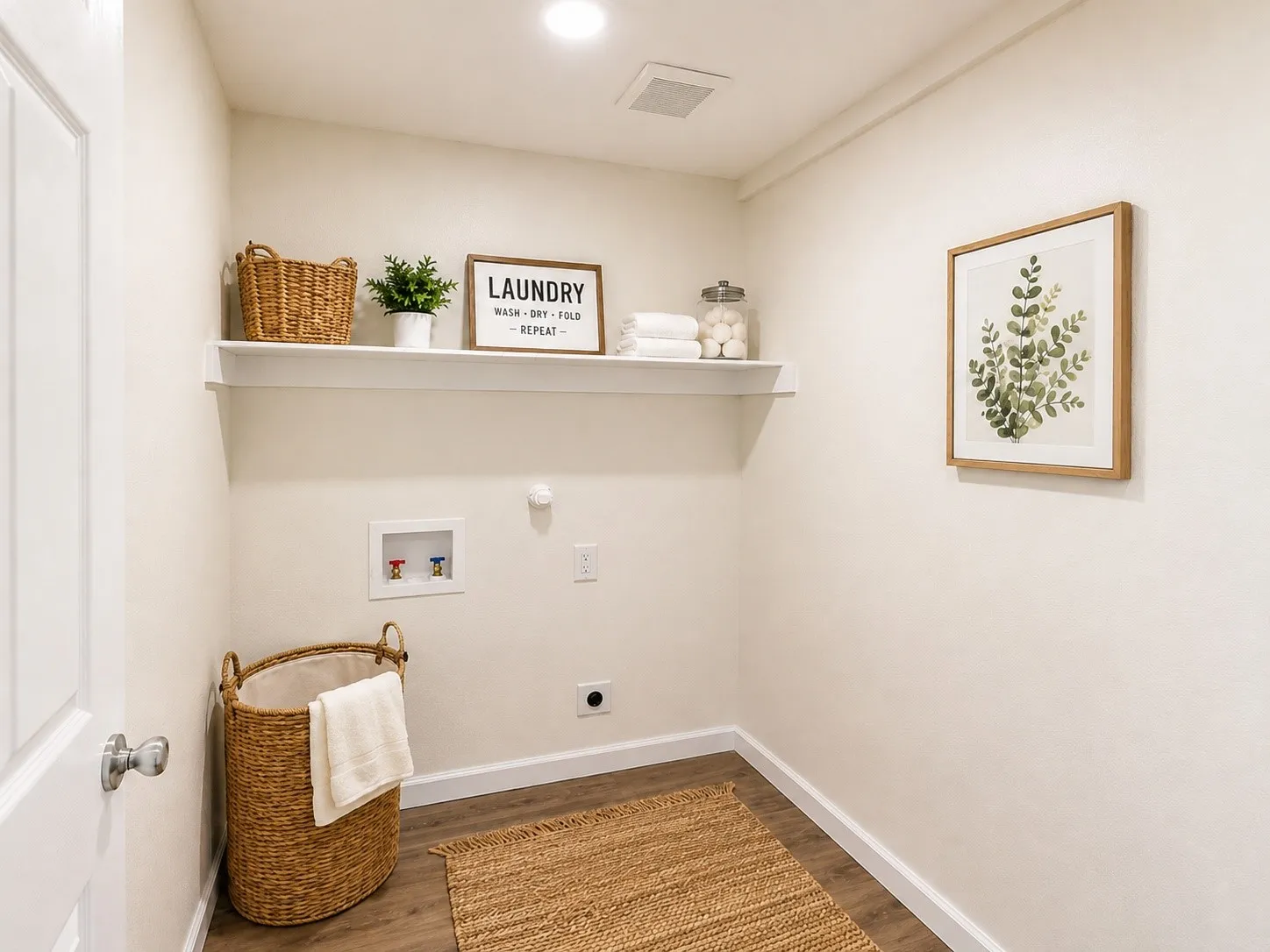 Laundry area with wood-finish flooring, a wall-mounted shelf, and recessed lighting