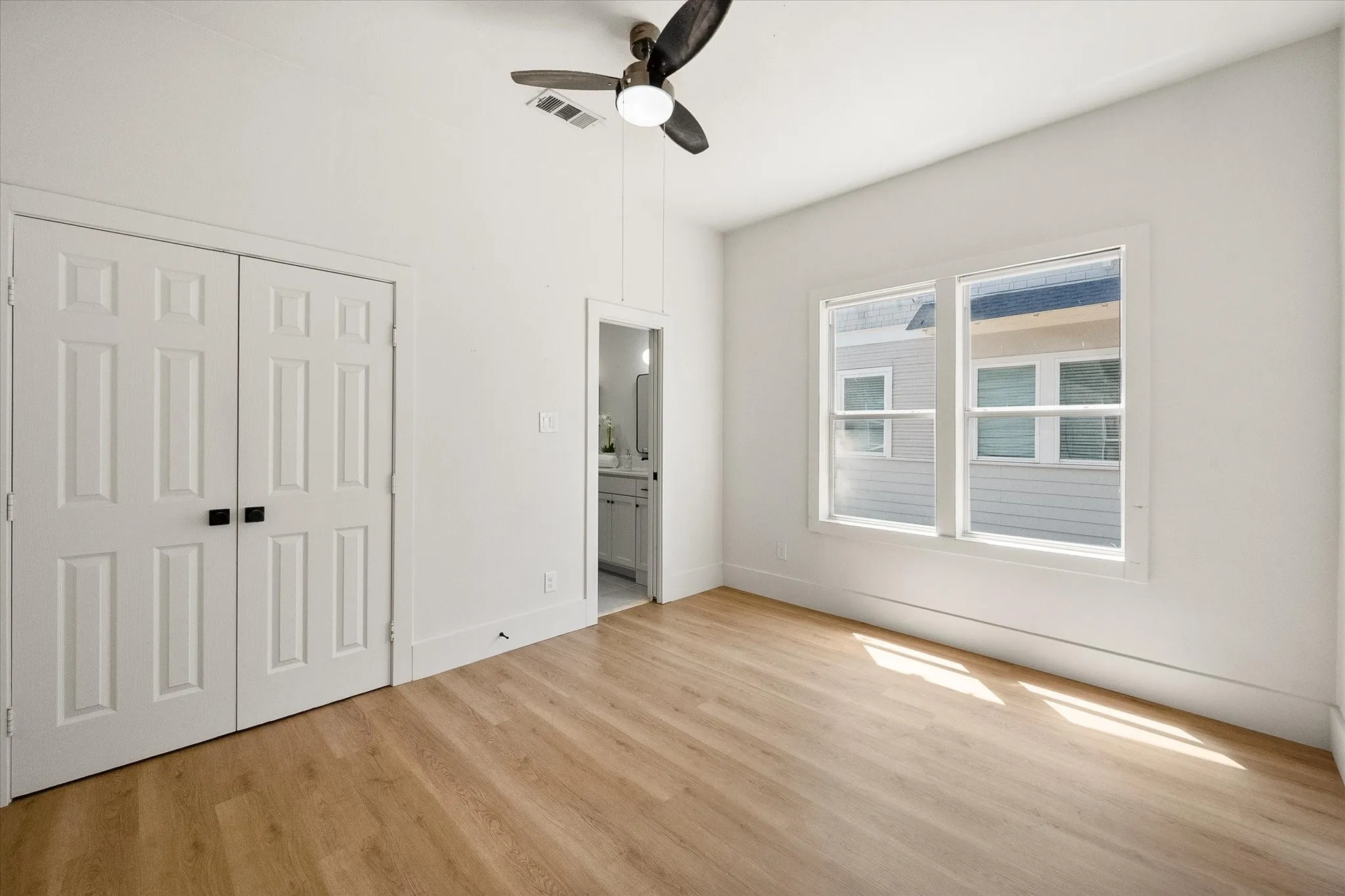 Primary bedroom features en suite bathroom.