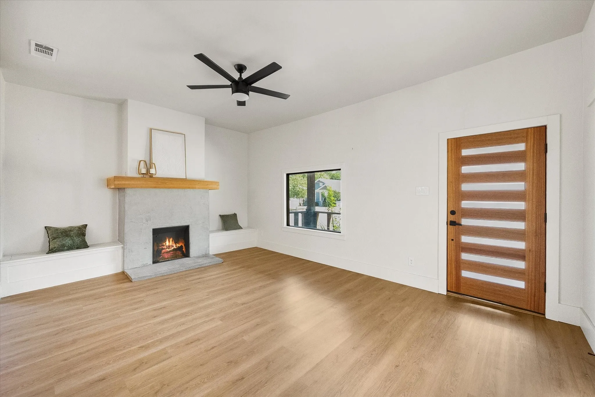 Modern fireplace anchors this spacious living room.