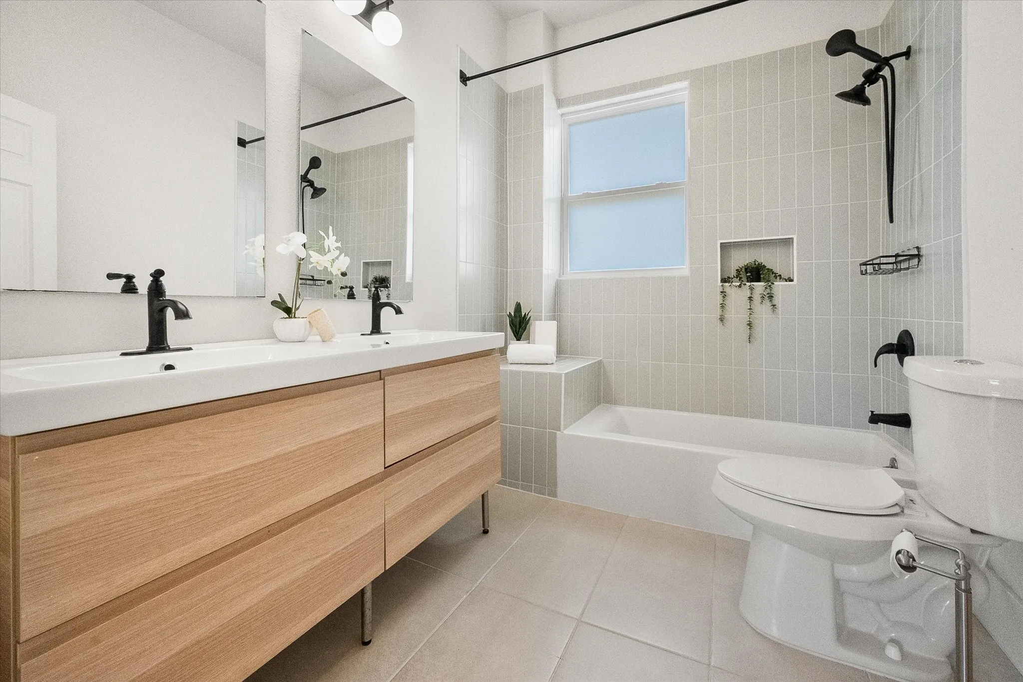 Second full bath also features dual sinks.
