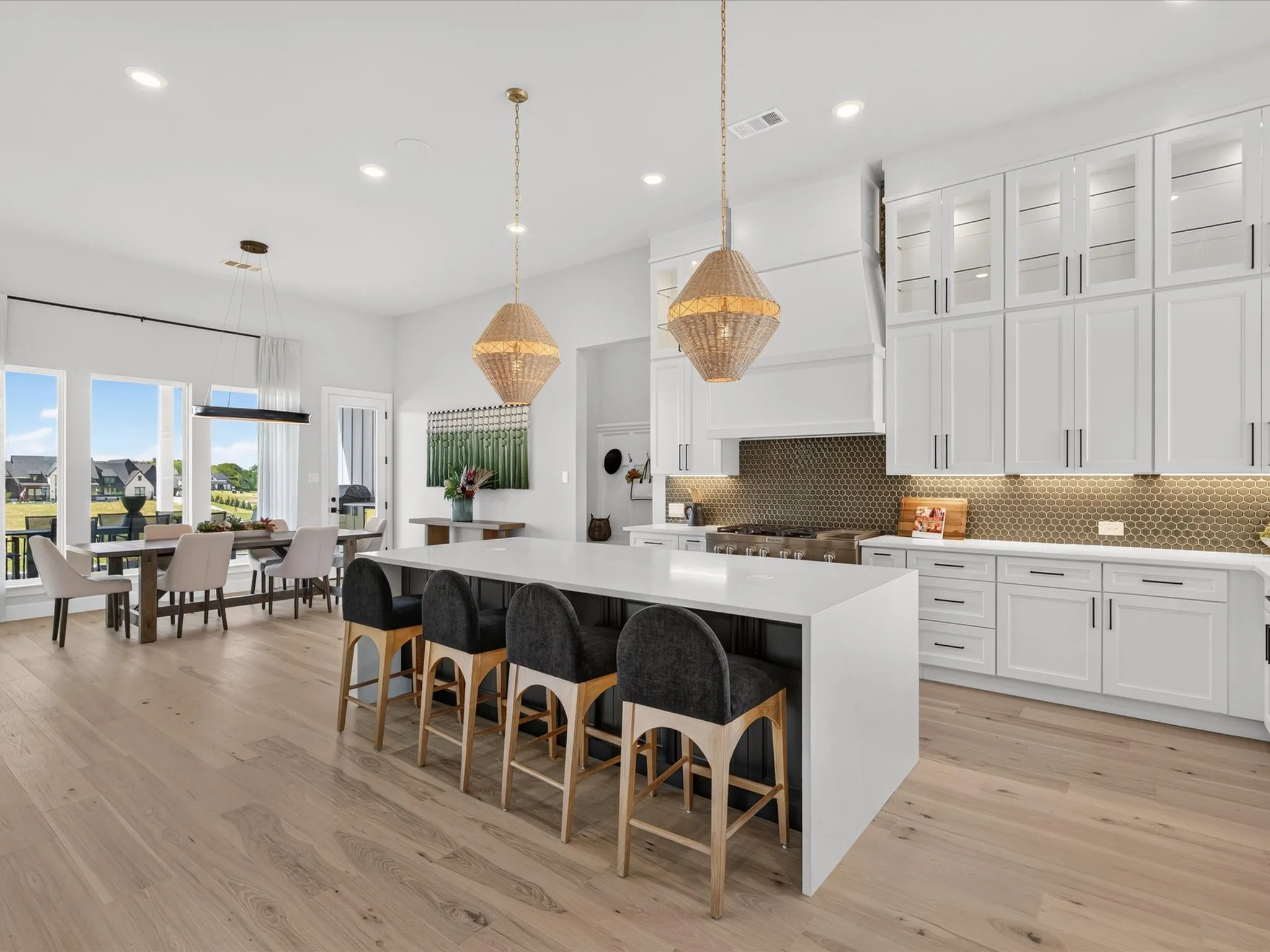 Spacious open-concept layout with light wood-finish flooring