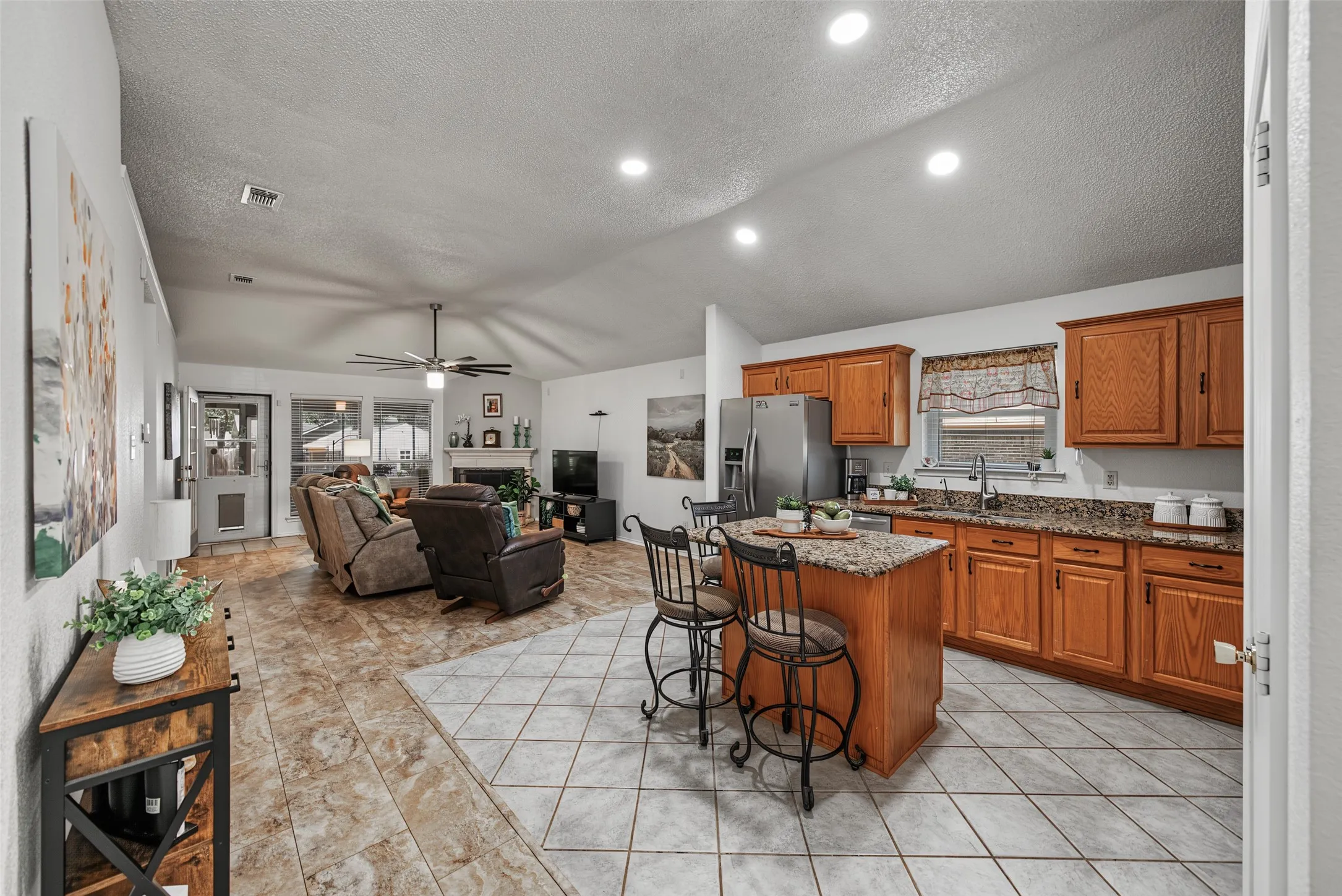 Open concept keeps the kitchen snack handy while binge watching your favorite shows