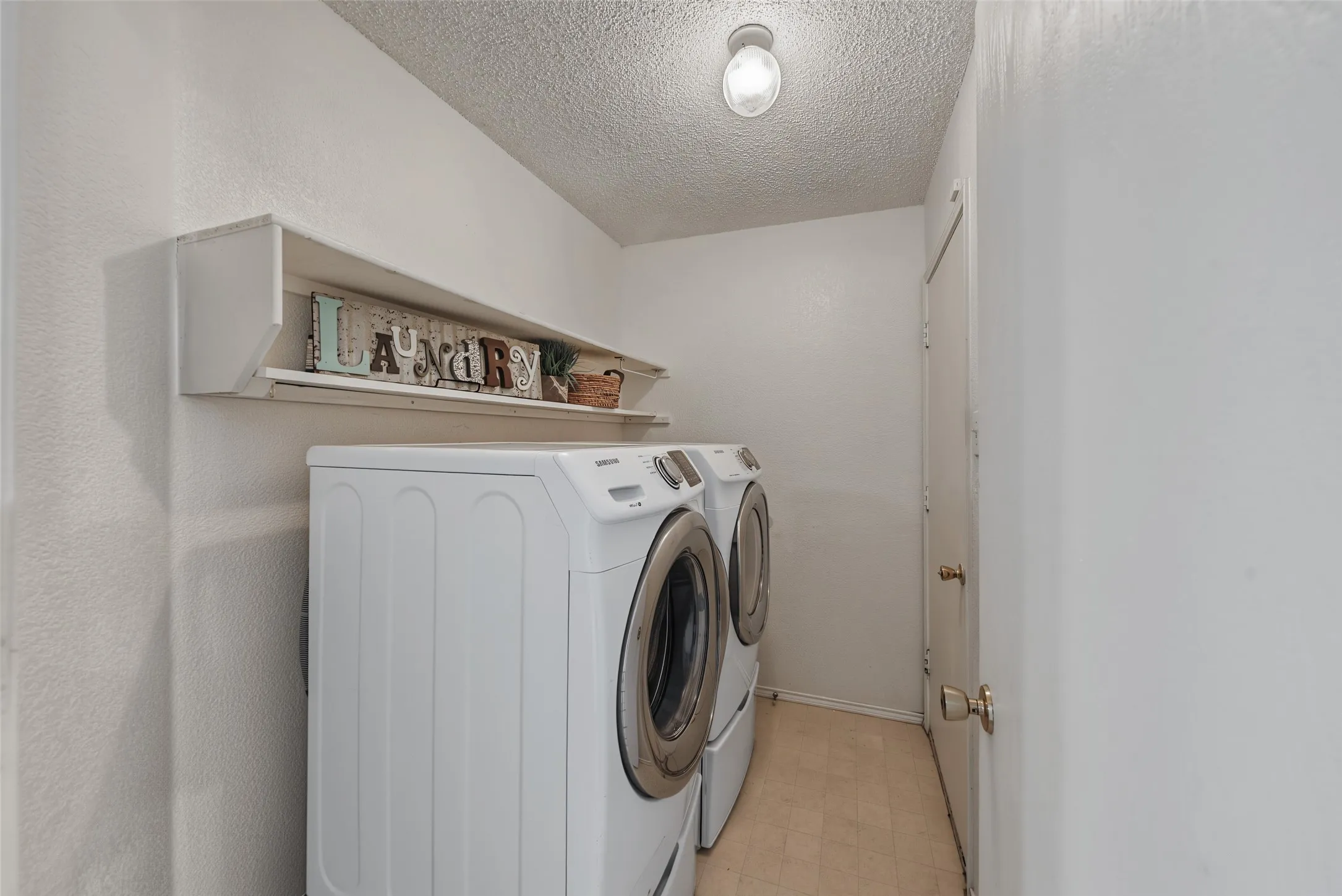 Tucked away, spacious laundry room
