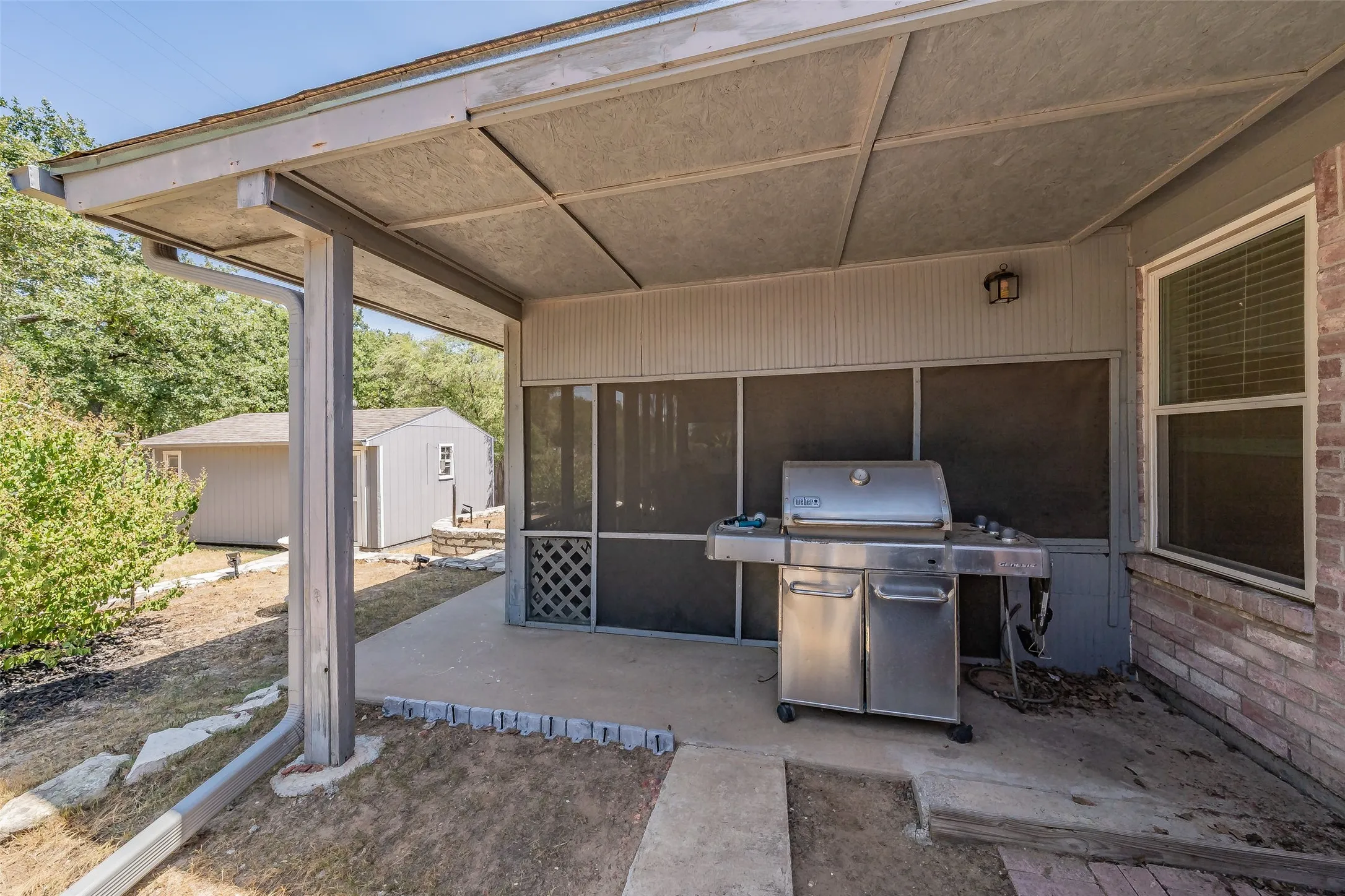 Side, covered patio. Perfect for your grilling station