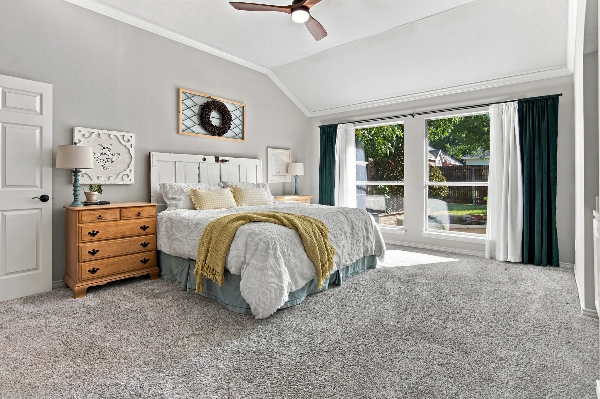 Primary bedroom has a lot of space and overlooks beautiful pool area