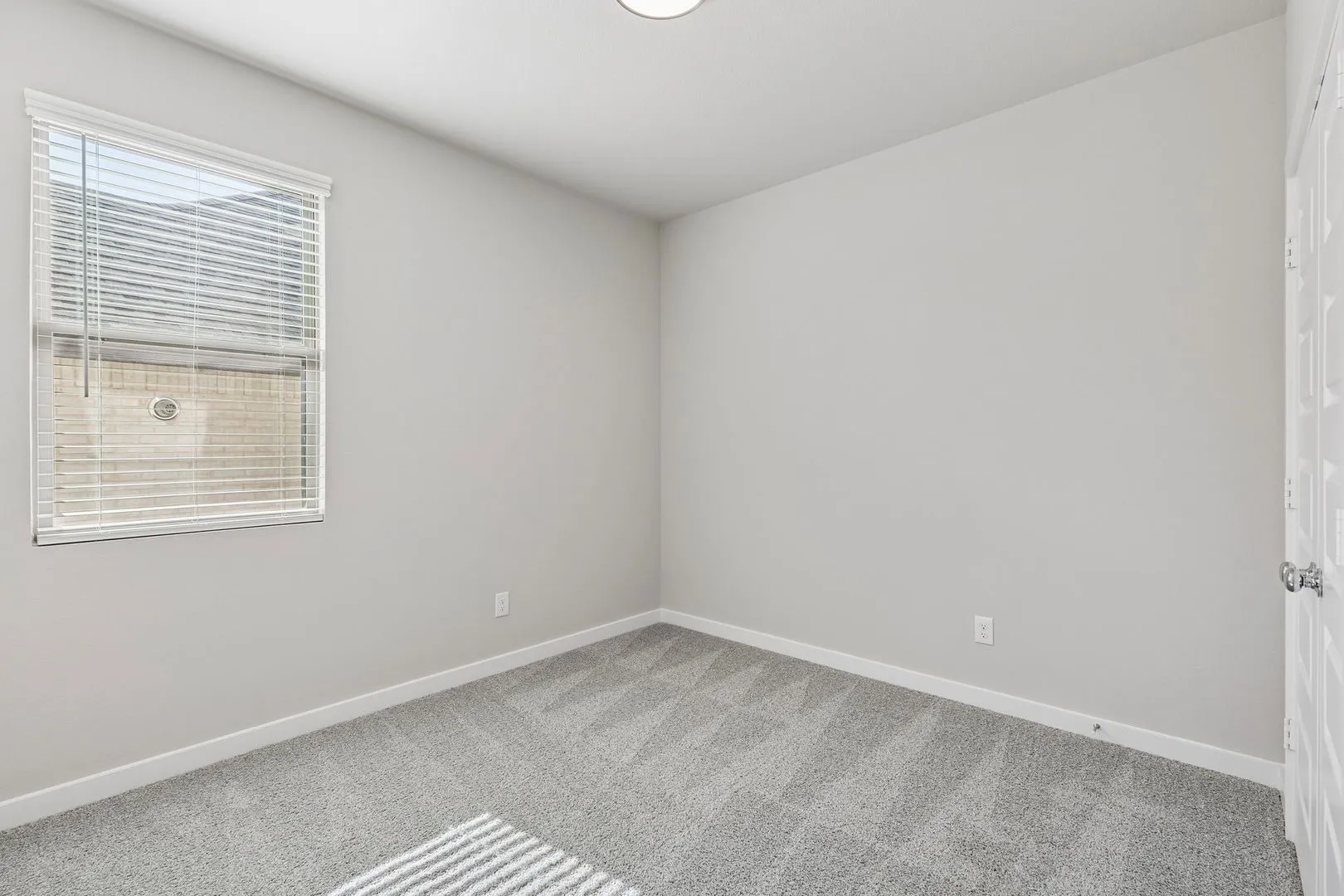 Bedroom in the Holden home plan by Trophy Signature Homes – REPRESENTATIVE PHOTO
