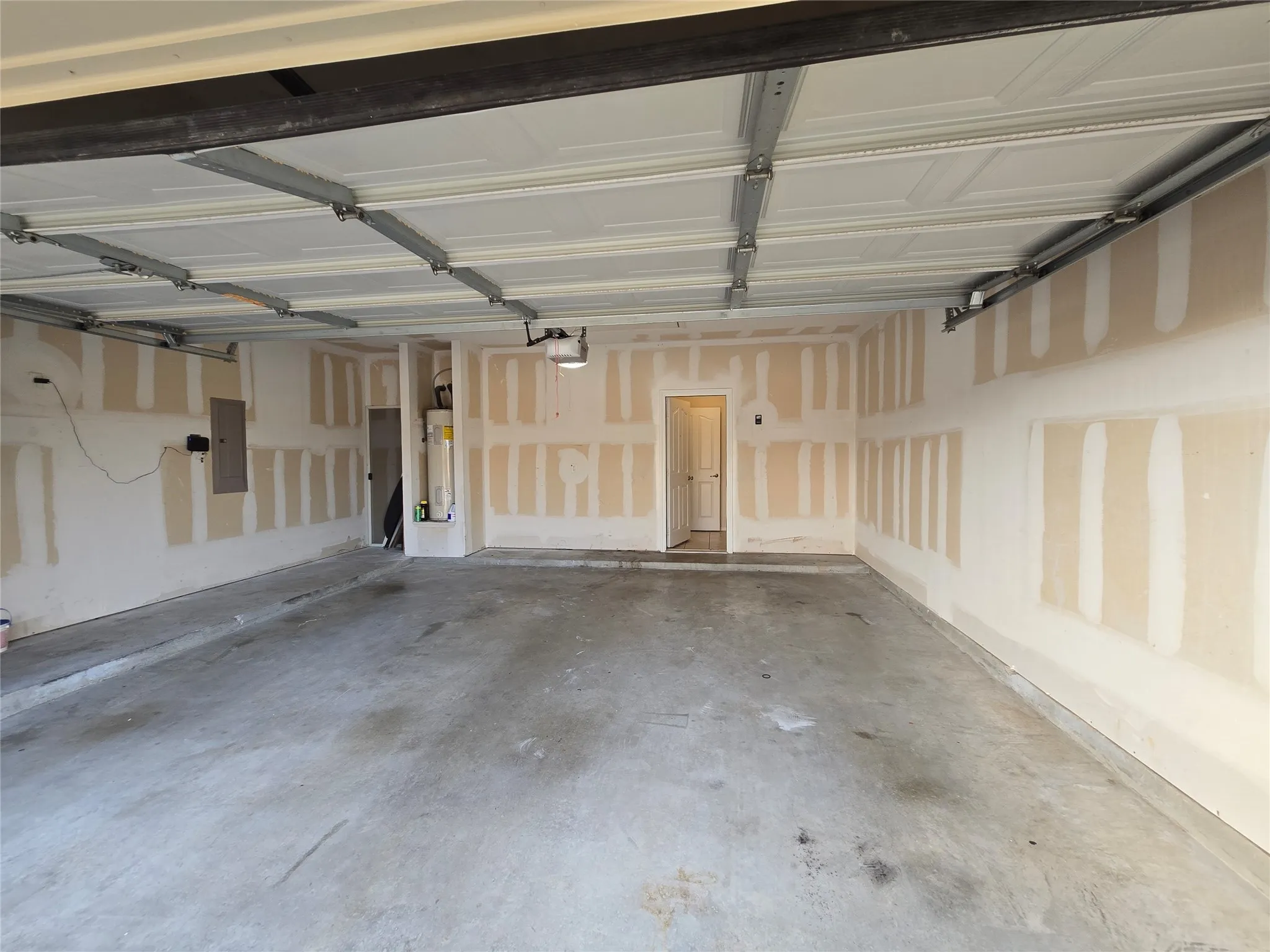 Garage with electric panel and electric water heater