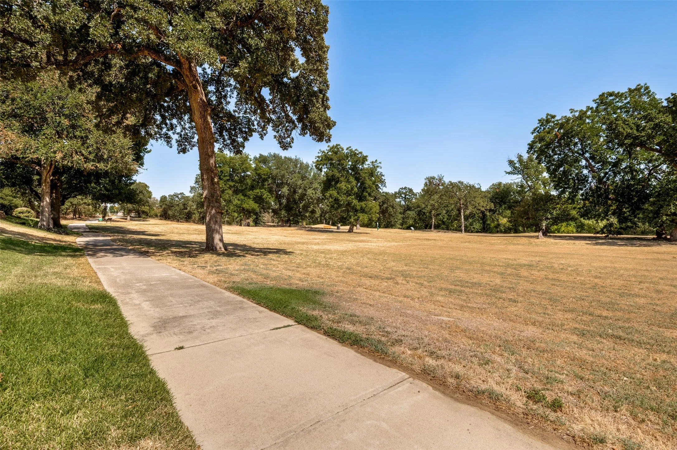 Back patio overlooks the greenspace and has access to the walking path