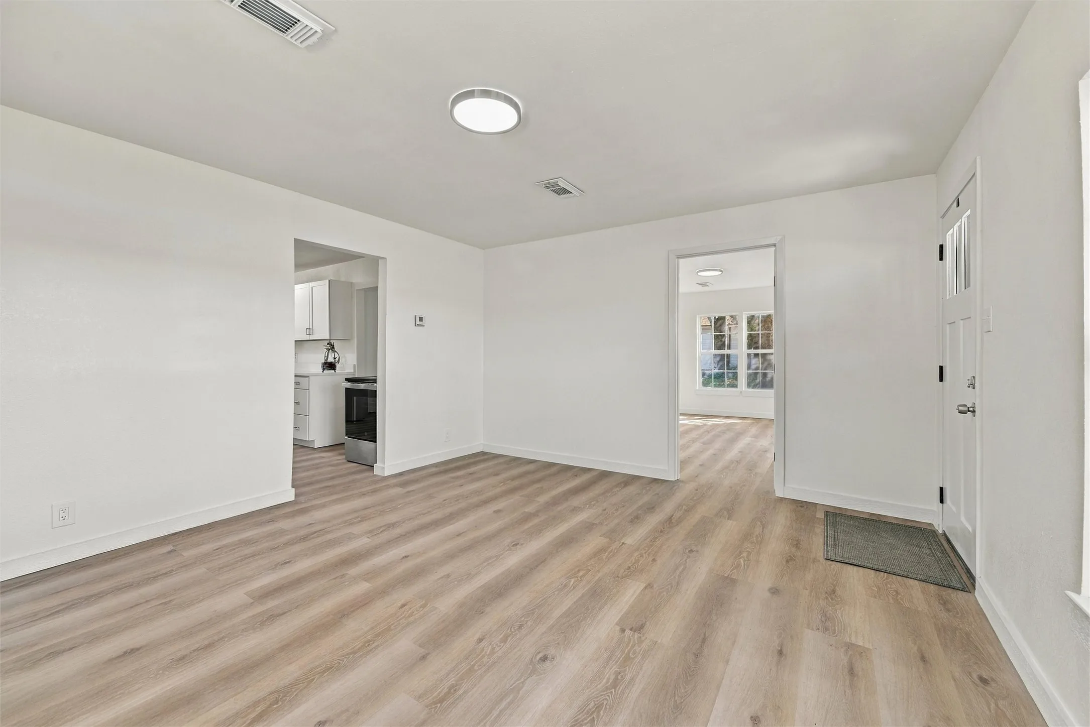 Comfortable living space with plenty of potential, and abundant natural lighting.
