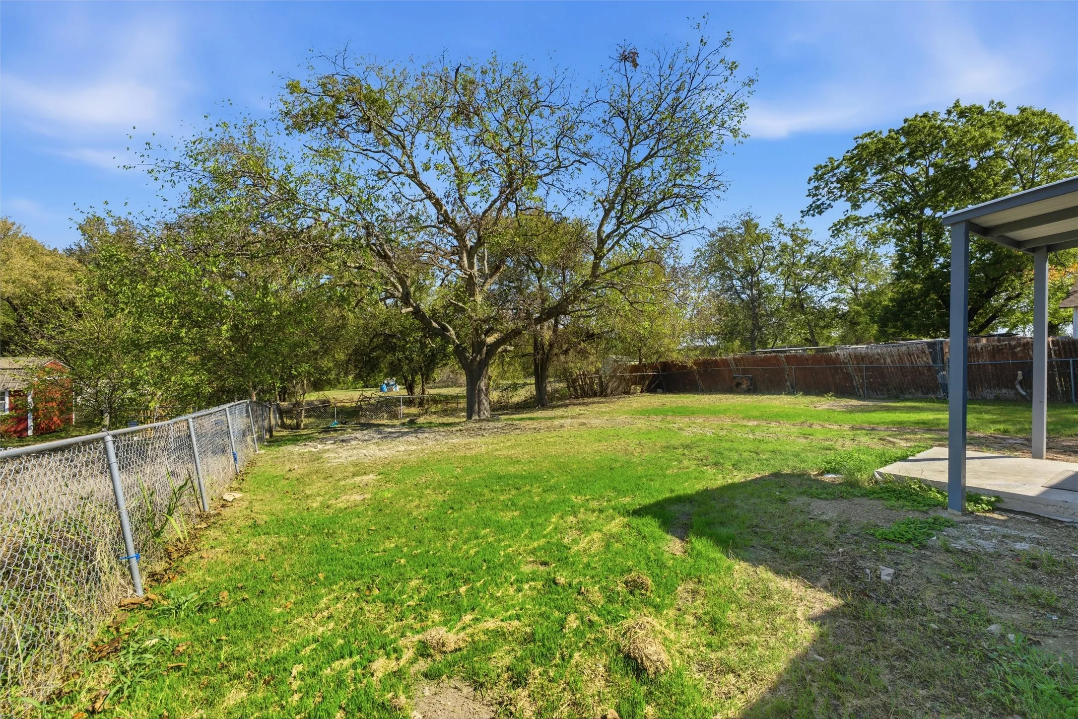 Expansive quarter acre lot with mature trees.