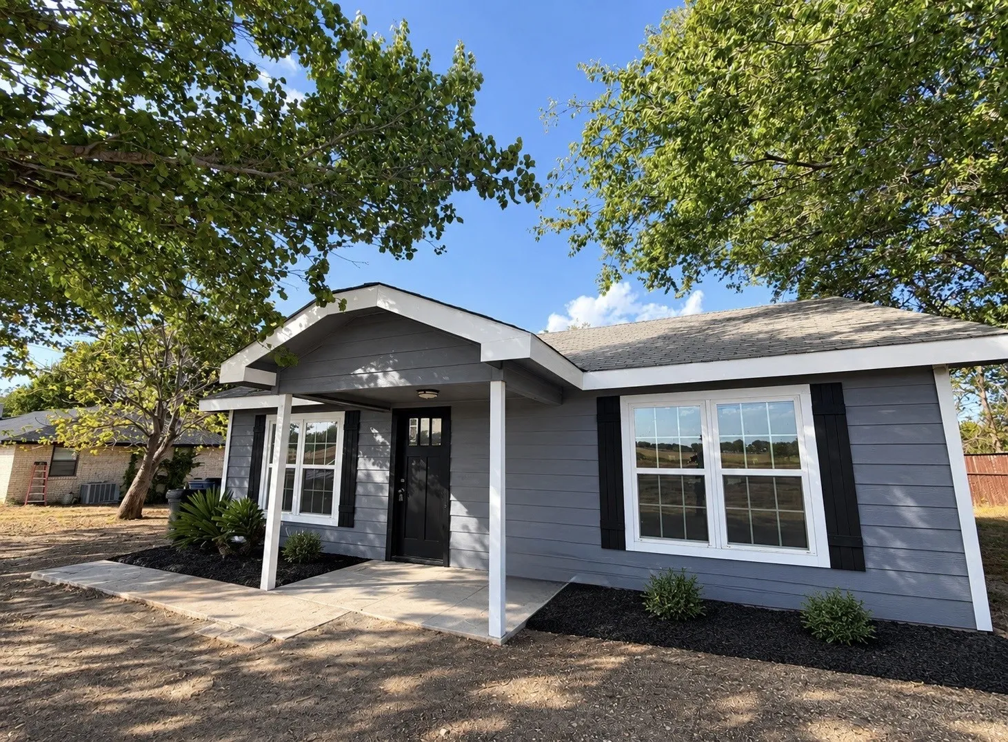 Charming home with mature trees and a welcoming curb appeal.