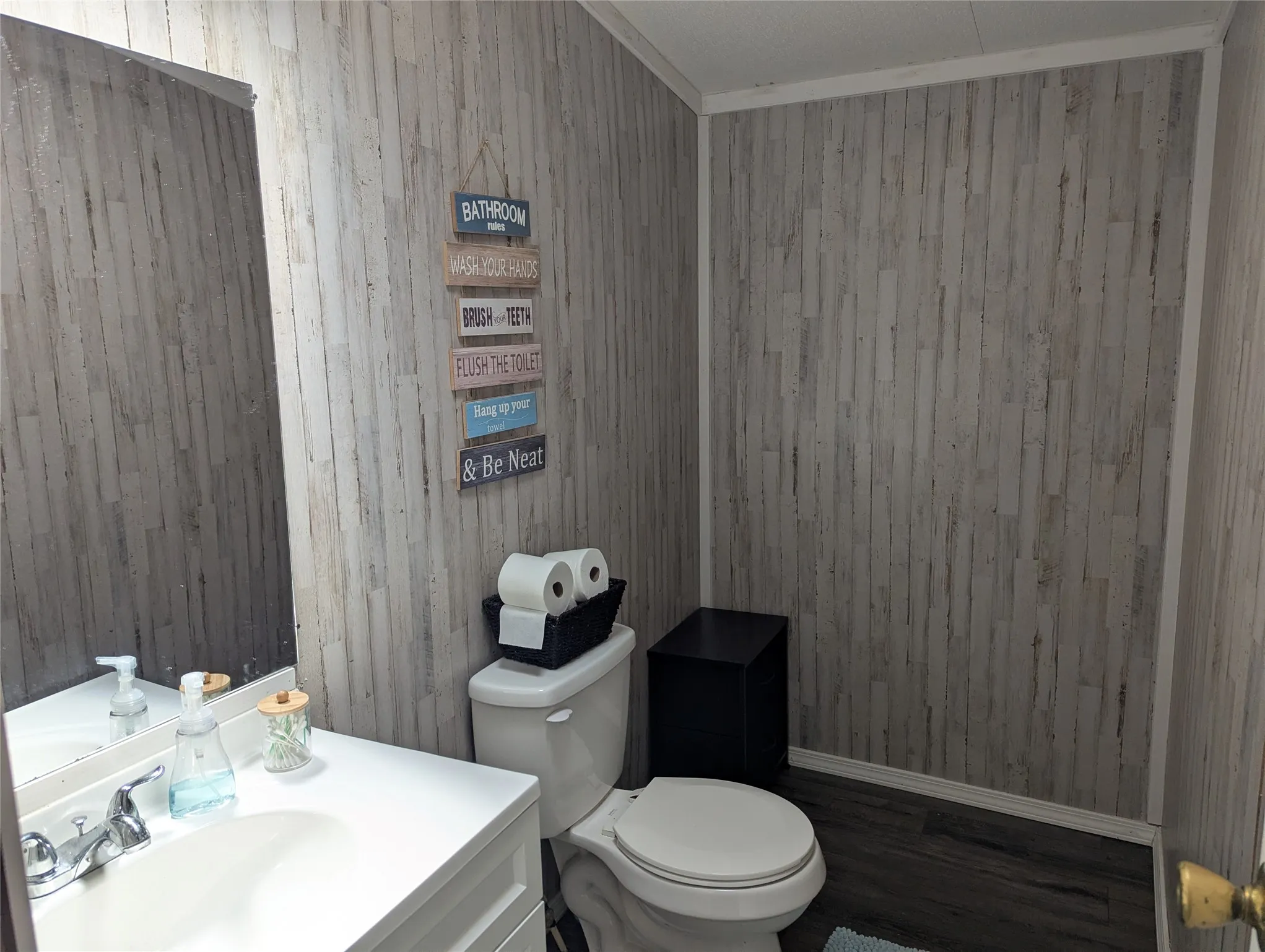 Half Bath - there is available plumbing behind the paneling to have a shower installed if buyer chose to do after purchase.