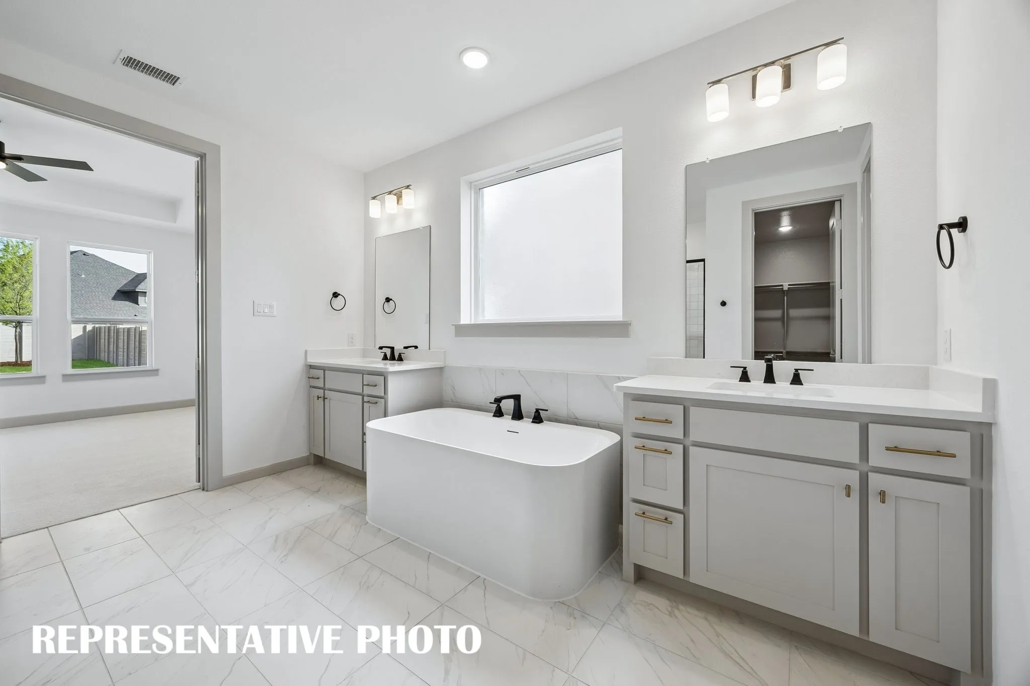 An owner's bath designed for two!  REPRESENTATIVE PHOTO