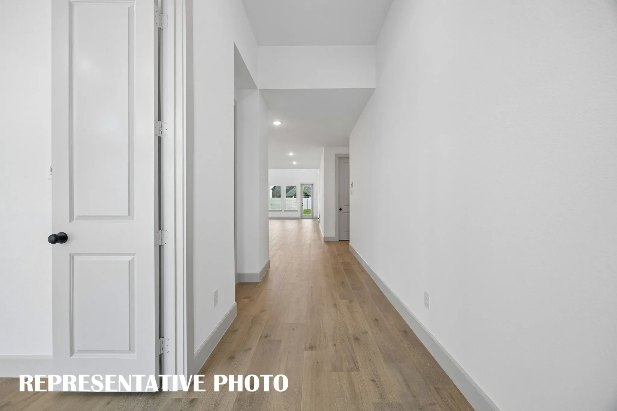 Open the door and enjoy site lines from the front through to the rear of this dream home including ample wall space to showcase artwork and family memories!  REPRESENTATIVE PHOTO