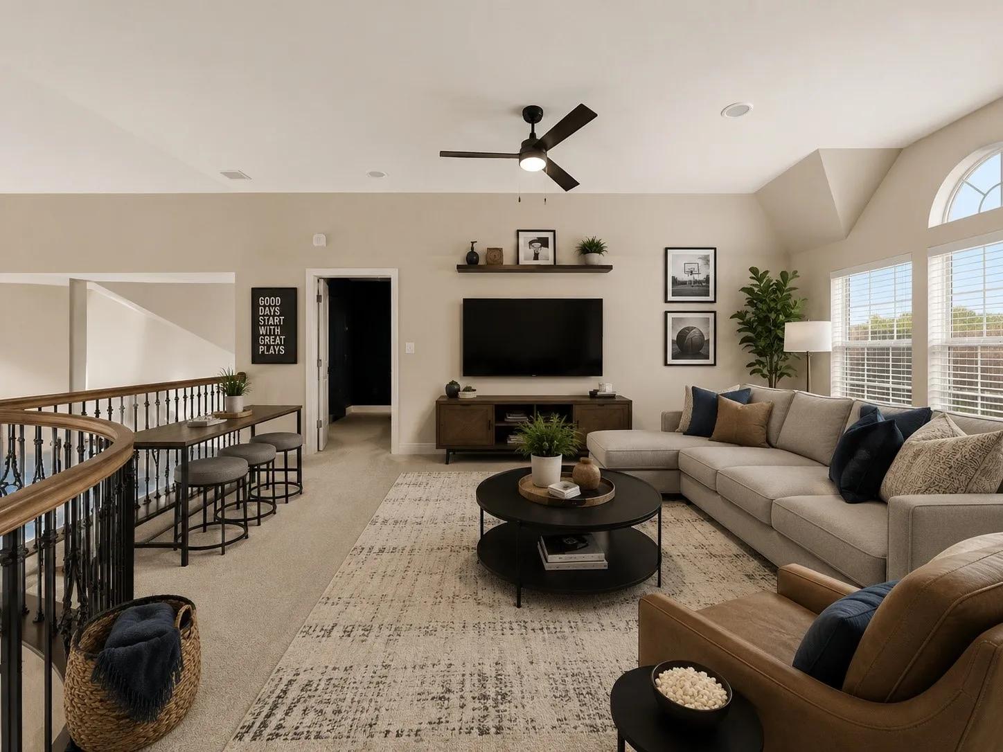 Virtually Staged Spacious upper-level room featuring vaulted ceilings, a ceiling fan with integrated lighting, and carpet flooring
