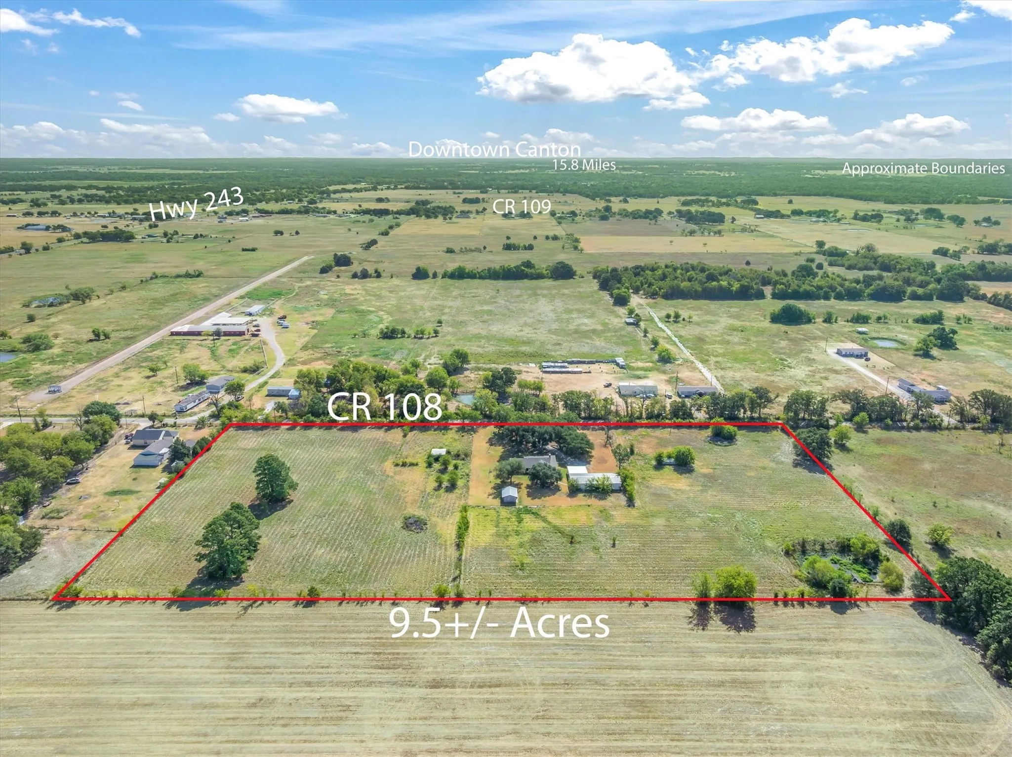 9.5+/- acres of undeveloped land, featuring open fields and scattered mature trees